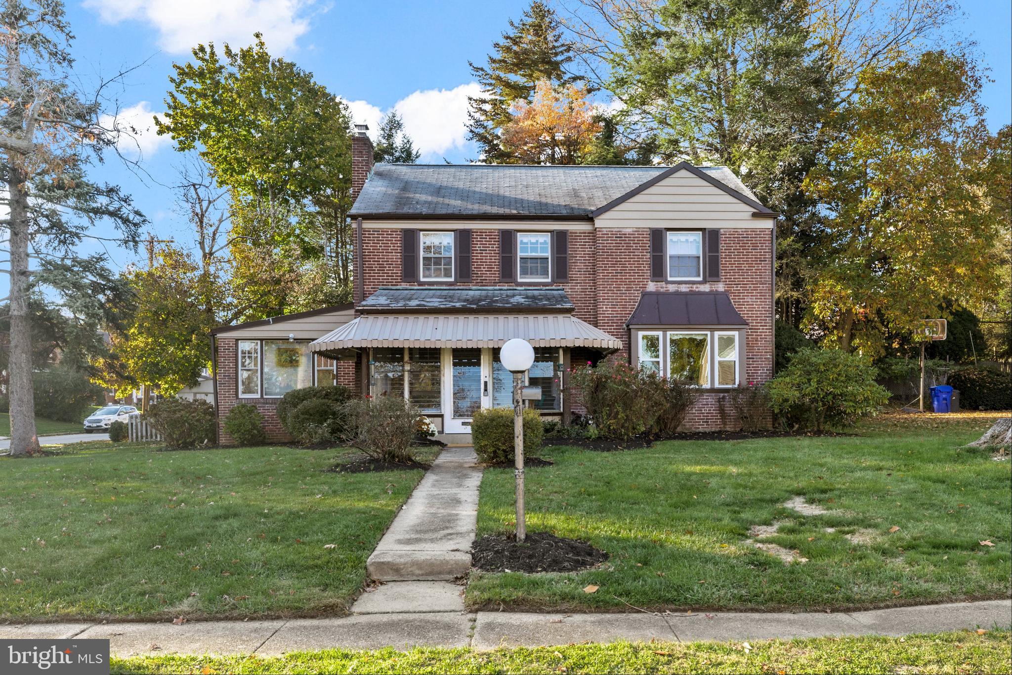 Interested in the new construction homes in the area but not the price? This solidly built house in a sweet neighborhood is awaiting your customization! With the legendary Cheltenham Township schools and services you can really have it all. Enjoy a cup of coffee on your three season screened in porch in your PJs
while watching the kids get on the bus at your corner. Enjoy family evenings around the fireplace in the large livingroom with gorgeous hardwoods that continue throughout the home. Practice the piano or read a book in the handy library or hide away in the paneled study with an outside entrance. The kitchen has a new floor and opens to a nice sized fenced in backyard ready for your landscaping fantasies, with a  covered patio, great for grilling and eating out doors.  There are three bright bedrooms upstairs and the master has its own bathroom with beautiful retro floor and wall tile in great shape. The other two bedrooms are spacious as well and share their own charming retro hallway bathroom. Store stuff in the nearly full height attic which could be converted to a fourth bedroom or fun playroom for children. There is a ton of storeage in the partially finished basement /laundry combo. Park the cars and enjoy a hobby in the two-and-a-half car garage. Close to  to public transportation, schools, shopping  and the terrific Tacony Creek Park. This house is sold AS-IS.