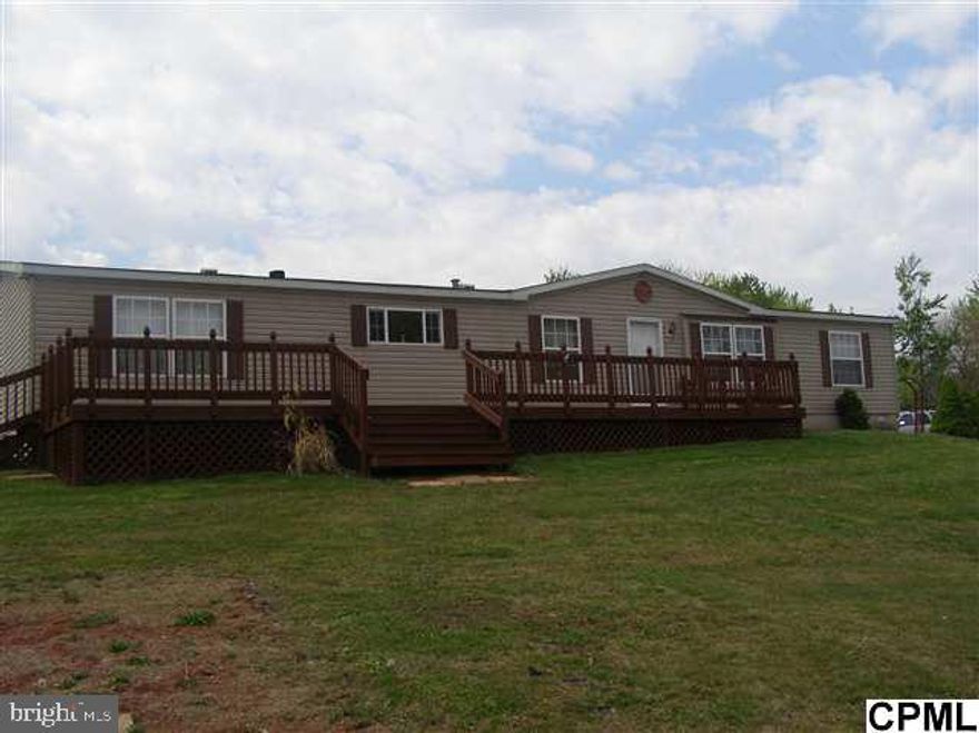 Well maintained Double wide sits privately on 3 acres.  Nice landscaping and large deck. Lots of room for summer entertaining.