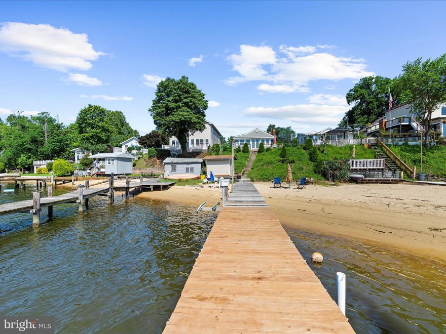 Own Your Personal Paradise – A Beach House with Its Very Own Private Beach
Wake up to the soothing sound of waves and step right onto your private stretch of sand. This isn’t just a home—it’s a lifestyle most only dream of. Enjoy stunning sunsets from your exclusive beach, where every evening feels like a getaway. Imagine winding down your day by a crackling fire, toes in the sand, watching the sky transform into breathtaking shades of gold and crimson. No crowds. No stress. Just pure, coastal bliss—yours year-round.

Waterfront Living with Breathtaking Views – Every Season, Every Day
Experience panoramic views of Rock Creek and the Patapsco River from the comfort of your home. Whether arriving by boat or by land, you'll love the unbeatable location—just minutes from top local restaurants and conveniences. This is more than waterfront living—it’s scenic beauty, everyday convenience, and lifestyle in perfect harmony.

Updated, Inviting Interior with Thoughtful Touches
Step inside to discover a beautifully renovated full bath featuring a custom walk-in shower and a handy linen closet. The bright and airy sunroom offers peaceful water views—ideal for your morning coffee or an evening escape. The cozy living area is anchored by a charming white brick fireplace, providing warmth and character all year long.

In the kitchen, enjoy a clever design with a washer and dryer neatly tucked behind the pantry door. Open the windows and let in the salty breeze, the rhythmic sound of waves, and the unmistakable scent of coastal life.

Room to Grow – and Dream Bigger
Need more space? With county permitting, there’s potential to expand. Just take a look at what the neighbors have done and imagine the possibilities.