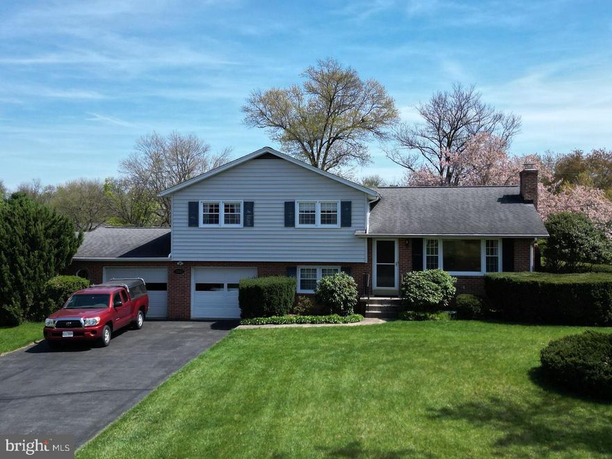 Welcome to this wonderful four-level split on an amazing .67-acre corner lot on a quiet street in fabulous Clover Hill, Frederick's premier neighborhood.  This property has amazing location, as it is tucked away on a seldom travelled street.  The main level features a spacious kitchen with peninsula island, breakfast bar, granite counters and plenty of cabinets, including a large pantry.  The main level also features a formal dining room with updated lighting and a huge living room, both with gleaming hardwood floors.  There are three bedrooms upstairs, including a primary bedroom with fabulous hardwoods, ceiling fan and ensuite half bathroom.  Rounding out this level are two more large bedrooms, each with hardwood floors, plus a spacious hall bath with ceramic tile floors. Downstairs is a fourth bedroom, second full bathroom and convenient laundry room with lots of cabinets, a utility sink, plus a service door exit to the backyard.  The finished lower level has a big family room with custom brick wall and a wood burning fireplace with wood stove insert.  This level also has a sizeable utility room with plenty of room for a workshop and storage.  The interior also has pulldown stairs to the attic, which is floored and supports significant additional storage.  Out back is a large patio overlooking the private backyard, which has mature landscaping, lovely gardens, two large storage sheds, and lots of room to play.  This amazing property has a massive 2-SUV garage with additional space for tools, a workshop and more.  The garage also has a service door exit to the backyard.  The Clover Hill community is amazing, with a 13-acre private park with pool, clubhouse, baseball diamonds, basketball court, tot lots, walking trails, picnic pavilion and more. This location is close to downtown Frederick, Fort Detrick and FCC and is easily accessible to all main commuting routes. This home is not in the HOA, although it’s possible to join and take advantage of the twice-weekly trash service, weekly yard waste recycling, twice-annual bulk trash pickups, and pool membership. This amazing property has been lovingly maintained by the ORIGINAL OWNERS, is move-in ready and priced to sell now!