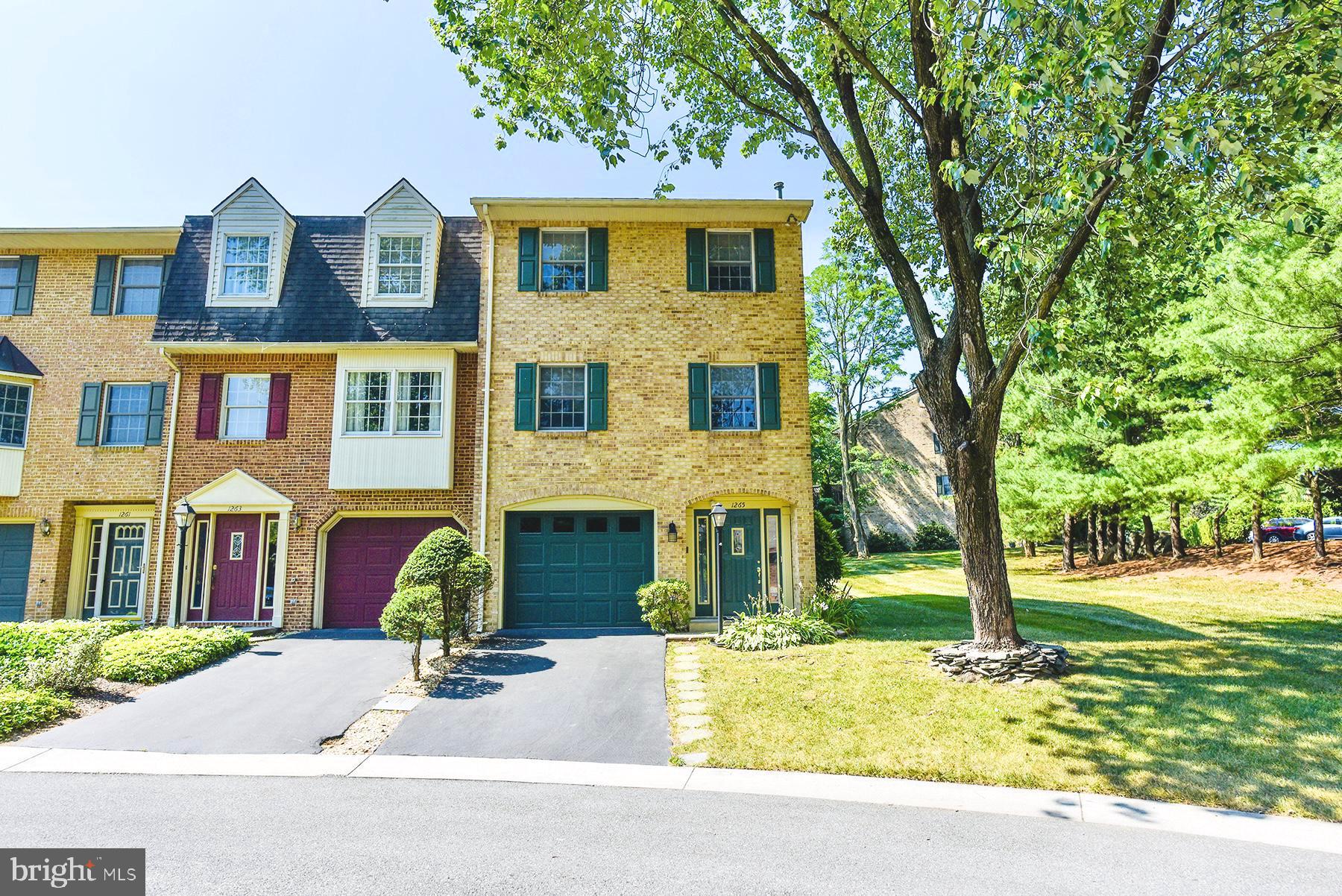 Beautiful move-in ready all-brick townhome in North Gate! This end unit is located at the end of Court 1 and features many upgrades! 2 bedrooms, 2 full and 2 half bathrooms, showcasing professional interior decorating by Jeanine Gift throughout. As you enter the home, you're greeted by a spacious foyer that leads to a first-floor family room with a natural gas fireplace and a half bathroom. This space could easily be converted into a 3rd bedroom if desired. Step outside from the family room to a covered brick patio and one of the largest fully fenced backyards in North Gate, perfect for relaxing and outdoor entertaining. Continuing to the second floor, you'll find fresh carpeting on the staircase installed by Burkholder's Flooring America. The second floor boasts a sizable living room with hardwood floors and a natural gas fireplace, a half bath, and a renovated eat-in kitchen with matching slate GE appliances, natural gas cooking, replaced light fixtures and silestone countertops. All appliances convey! The kitchen opens to a second-floor deck, complete with an electric SunSetter awning, ideal for relaxing in the shade. The third floor is dedicated to a primary suite, featuring vaulted ceilings, a walk-in closet, and a full bathroom with a skylight, creating a bright and airy retreat. As well as a large second bedroom with its own full bathroom. Laundry room on the sleeping level. Enjoy the comfort of central air conditioning and natural gas heat. Additional features include a 1-car garage with new garage door and a utility room, providing ample storage space. The HOA offers numerous amenities, including a community pool, lawn maintenance, snow removal, walking paths, and a playground. Conveniently located near schools, shopping, restaurants, and major highways I-70 and I-81. Don't miss the opportunity to make this move-in ready townhome yours!