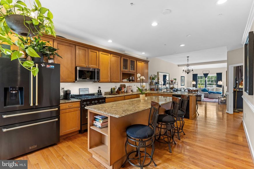 Gorgeous Villa with incredible views of the second hole green on the Waverly Woods Golf Course.  Main level primary bedroom with bathroom.  Gourmet Kitchen with granite counter tops, huge island and high end glazed cabinets.  Gleaming hardwood floors throughout! Main level laundry.  Fully finished basement with a full bath.  2 car garage.  Maintenance free deck and large custom patio.  Over 3000 finished square feet! Don't miss out on this one.  These models rarely come on the market!