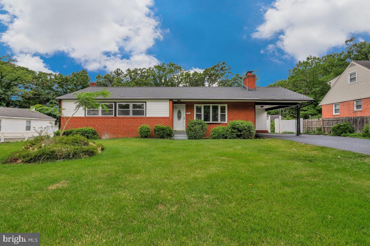 Welcome to this huge, beautifully remodeled detached brick rambler, offering immediate possession and an abundance of living space. Perfectly situated on a large, level, fenced lot in Oxon Hill, this home combines modern upgrades with timeless character. The exterior features a new roof, gutter guards, insulated windows and doors, a storm door, and a one-car carport with an oversized driveway for ample off-street parking. Two outbuildings provide additional storage and convey in as-is condition. Inside, the main level boasts gleaming hardwood floors, recessed lighting, and a bright living room with a wood-burning fireplace and bow bay window. The dining room is highlighted by French doors, leading seamlessly into the remodeled kitchen with brand-new cabinets, quartz countertops, ceramic tile backsplash, stainless steel appliances, upgraded refrigerator, electric range, built-in microwave, dishwasher, disposal, and new flooring. This level also includes five bedrooms—two of which are en suites, all with ceiling fans—and three full bathrooms, offering plenty of comfort and flexibility. The partially finished basement expands your living options with a convenient rear walkout. It features a spacious recreation room with a second wood-burning fireplace, a full bathroom, a versatile den/study/flex room, and an additional bedroom. Key system upgrades include a new water heater, sump pump, and dual-zone HVAC for efficiency and peace of mind. Outside, enjoy the expansive fenced yard and the convenience of nearby shopping, dining, entertainment, and major commuter routes. Vacant and move-in ready, this home is a rare find—offering size, thoughtful upgrades, and location all in one. This one won't last long, schedule your showing today!