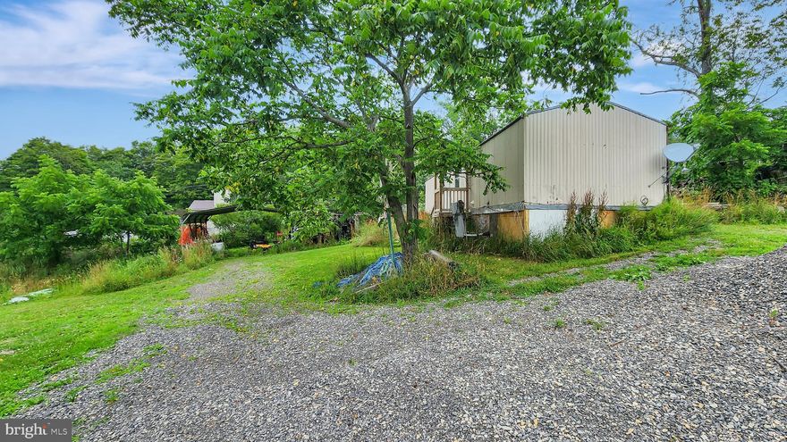 This could be a chance to be a great place to call home with some TLC. Large Yard, Huge driveway, Awesome views, and soooo much potential.