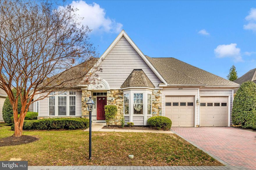 Experience elevated living in the prestigious Wormans Mill community of Frederick, Maryland. Set along a charming colonial courtyard, this impeccably maintained residence offers timeless elegance, modern comfort, and effortless convenience. Enjoy true low-maintenance living with exterior care and snow removal included. The main level features all-new flooring and fresh paint, a light-filled great room with a gas fireplace, and a beautifully updated kitchen with gas cooking, double ovens, and brand-new appliances. A sunny morning room and private porch provide inviting spaces to enjoy coffee or unwind at day’s end. The main level also offers two bedrooms plus a spacious primary suite with a recently updated luxurious bath, along with a convenient main-level laundry room. The finished lower level provides additional living space with a cozy fireplace, half bath, and abundant storage. Added peace of mind comes with a brand-new roof, and an attached two-car garage. Just steps from boutique dining, cafés, parks, and premier community amenities—including a pool, clubhouse, fitness center, courts, and scenic walking paths—this home delivers both luxury and lifestyle. All just minutes from Wegmans, major shopping, commuter routes, and historic downtown Frederick. Welcome home to elegance, convenience, and refined community living. Schedule your private tour today.