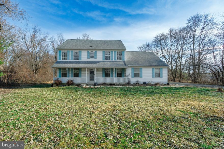 Situated on an expansive lot of over 2 acres with an inviting front porch, this custom Colonial offers a traditional floor plan and represents a significant opportunity for renovation and personalization. The center-hall entry is flanked by formal living and dining rooms, leading to an open-concept kitchen that flows into the great room. Highlighted by a fireplace, the great room provides a versatile space for gathering and overlooks the large rear grounds. Upstairs, the primary bedroom features an en suite bath and generous closet space, accompanied by three additional well-proportioned bedrooms and a full hall bath. Both the primary and hall bathrooms have been updated. This property offers an opportunity to update a custom-built home to your specific tastes. Notable features include a tankless hot water heater for efficiency. Appreciate convenient access to I-95, Philadelphia, Princeton, and NYC, all while enjoying the unique charms of Bucks County living. Indulge in the local restaurants, shopping, and recreational activities in Newtown and its neighboring communities. All of this comes alongside the highly-rated Council Rock School District.