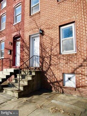 Fantastic 3 bedroom townhome just steps away from the B&O Train Museum in Hollins Market! Spacious interior is accented by large windows and wood flooring throughout! Modern kitchen comes well-equipped with stainless steel appliances, generous cabinet storage, and access to a private rear parking pad! Upper level offers 2 bedrooms with wall-to-wall carpeting that share a full bath. Third floor master suite boasts an attached full bath with soaking tub, vaulted ceilings, and walk-in closet! Bonus unfinished basement has tons of extra storage space and full size washer dryer for added convenience! 5 minutes from University of MD Medical Center 10 minutes to Inner Harbor/Downtown Convenient to Oriole Park Camden Yards and M&T Bank Stadium Pets up to 25lbs welcome with additional deposit! Proof of renter s insurance required.Application Qualifications: Minimum income of 3 times the monthly rent, no evictions or recent filings, current accounts in good standing, and a clean criminal background check.