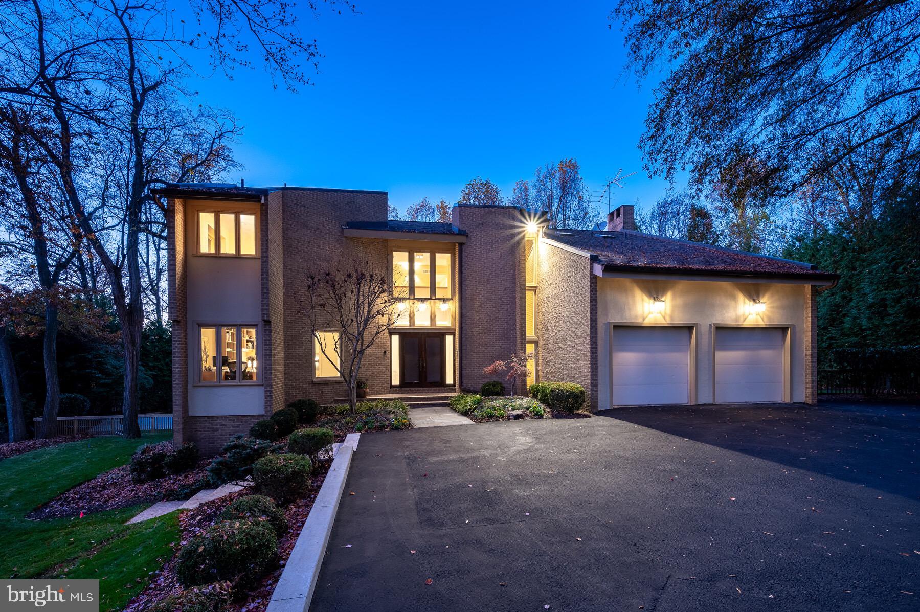 Situated on a quiet cul de sac in North Bethesda’s most sought after neighborhood, this home is timeless and perfect for today’s lifestyle. Custom-built for these original owners, it incorporates an open floorplan with 5700 square feet of living space beautifully sited on a private half an acre, conducive to today’s more informal living. Gracious landscaping surrounds the property, and a newly renovated heated pool and flagstone patio, makes for ideal outdoor living. Located in the heart of the popular Luxmanor neighborhood, this wonderful home enjoys easy access to I-270 and I-495, close proximity to the Green Acres/Diener School, Luxmanor ES and Tilden MS, as well as two neighborhood pools, several county parks, shopping and restaurants including Pike and Rose, Wildwood Shopping Center and Westfield Montgomery Mall.
The interior is special. The “user-friendly” floorplan features a two-story, 18’ entry Foyer with balcony overlook and clerestory windows above the double-door entry with etched glass side panels. The first floor has nine-foot ceilings throughout. A focal point of the Main Level is the large Living Room with skylights in the vaulted ceiling and a wood-burning fireplace with marble trim and hearth. Both the Living Room and Dining Room have doors to the deck and overlook the backyard and swimming pool. A Home Office (or Study) with built-ins is conveniently located off the Foyer.
Informal comfort reigns with a Kitchen that has been renovated and updated with upgraded stainless-steel appliances, including a side-by-side Subzero refrigerator and freezer; Wolf cooktop and double wall ovens and microwave; natural, light stained cabinetry; an island perfect for informal meals; and a desk area for the home computer. Open to the Family Room with eating space and a second wood-burning fireplace, this area is perfect for more relaxed living. Adjacent to the Family Room is an “All Seasons” Porch with deck and staircase to the backyard, which makes the pool and patio readily accessible from the Kitchen and Family Room. Completing the first floor is a Full Bathroom/Powder Room and a wonderful Mudroom with wine cooler, pantry, built-in ice machine, coat closet, additional counter space, and cabinets, with access to side yard and the oversized, two-car Garage.
The Upper Level has also been well thought out with a large Primary Suite with two Full Bathrooms, one with a whirlpool tub and the other a with stall shower, as well as a large, organized Walk-in Closet. Adjacent to the Primary Suite is a Sitting or Exercise Room with atrium door to the Upper Level Deck. Three additional Bedrooms and third and fourth Full Bathrooms as well as a Laundry room with large Walk-in Closet and Storage area, complete the Upper Level.
The Lower Level is open and has new carpeting and offers lots of options for the most discerning buyer. Currently the Recreation Room with third fireplace walks out to the pool and patio, and a Game Room with Sitting Area could also be a large play area. The Storage/Utility Room provides extra storage space as well as a rough-in for a future Bathroom.
