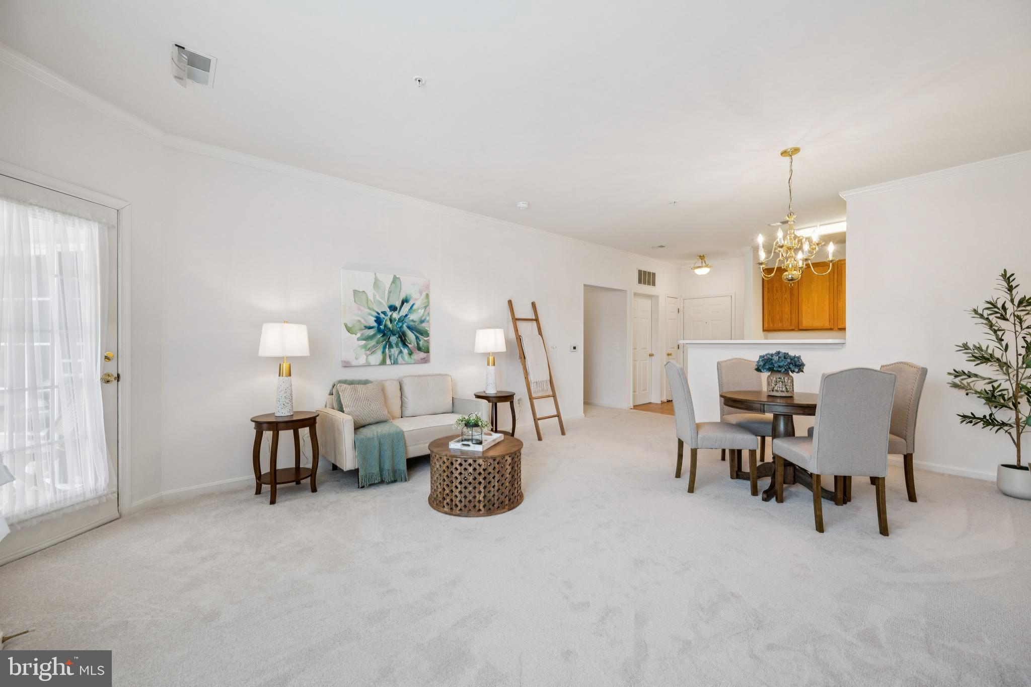 Welcome to this beautifully updated 1-bedroom + den, 1.5-bathroom condo offering 1,263 square feet of spacious, light-filled living in a vibrant 55+ community. Freshly painted throughout with brand new flooring, this move-in-ready home features an open-concept layout that seamlessly connects the kitchen, dining, and living areas—perfect for both relaxing and entertaining. Enjoy the convenience of a walk-out balcony accessible from both the living room and oversized primary bedroom, where you'll find a cozy sitting area and two massive closets for all your storage needs. The primary bathroom boasts a large walk-in shower for ultimate comfort and ease. Need a home office or hobby space? The versatile den offers a quiet, dedicated area ideal for working from home or enjoying your favorite pastimes. With ample natural light, a modern layout, and thoughtful updates throughout, this condo offers the perfect blend of style and practicality in a welcoming community. There is also a included garage space, keeping you warm and dry from the elements. Community amenities include elevators, exercise room, party room with full kitchen, snow removal, trash, water, and common area maintenance. Don't miss the opportunity to enjoy easy, low-maintenance living in a well-appointed home designed for comfort and convenience. Schedule your tour today!