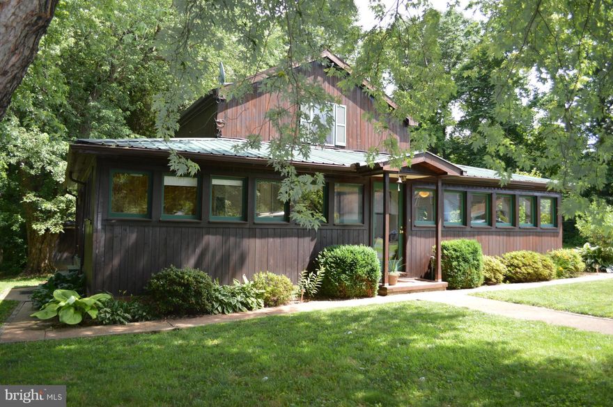 A true country retreat - peace and quite in a log cabin ...... rent for $1,200/mo.  3 bedrooms, 1.5 bathrooms, central air, wood burning fireplace, large wrap around porch addition.....