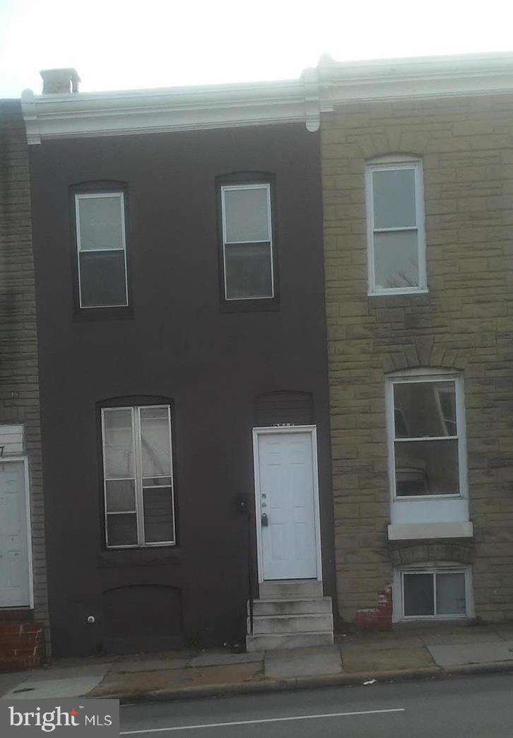 This 4 bedroom, one bath, rowhouse is just a few blocks east of Johns Hopkins Main Hospital, and convenient to main transportation routes. There is one bedroom on the first floor and three on the second (one is a walk through). Table space kitchen and fully enclosed back patio. Washer and dryer hookups in the unfinished basement. The high efficiency furnace was installed in 2016 and the roof was coated in 2019