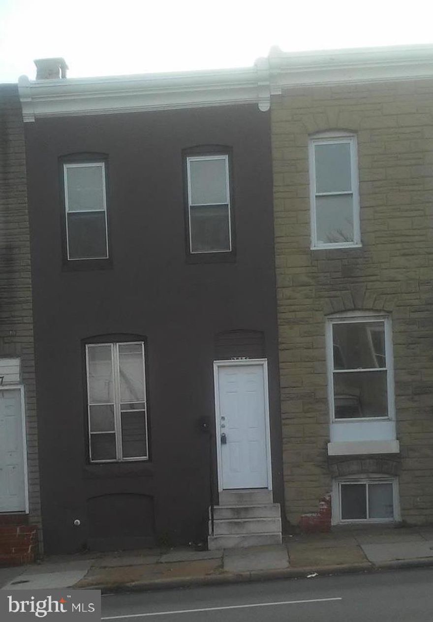 This 4 bedroom, one bath, rowhouse is just a few blocks east of  Johns Hopkins Main Hospital, and convenient to main transportation routes.  There is one bedroom on the first floor and three on the second (one is a walk through).  Table space kitchen and fully enclosed back patio.  Washer and dryer hookups in the unfinished basement.  The high efficiency furnace was installed in 2016 and the roof was coated in 2019