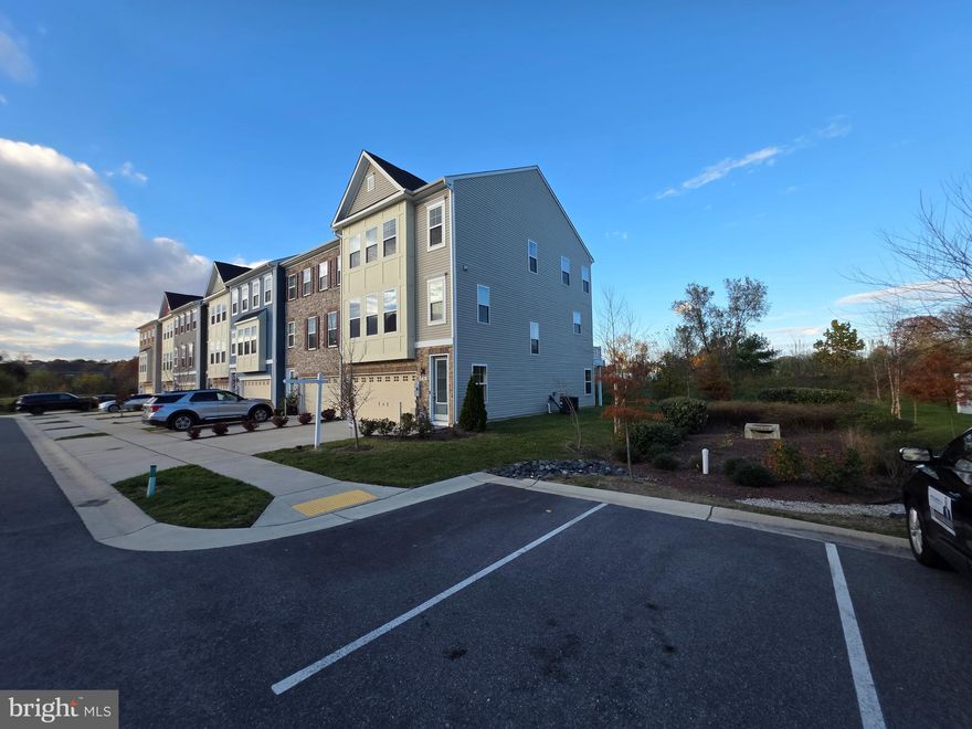 WATCH THE FULL YOUTUBE 13+ MINUTE PROPERTY TOUR WALK & TALK VIDEO FOR A TRUE VIRTUAL SHOWING WITHOUT EVER STEPPING FOOT IN THE HOME (SOME WEBSITES LIKE TO TRY TO HIDE THE VIRTUAL TOUR LINK SO LOOK EVERYWHERE FOR IT AND YOU WILL FIND IT)!  WELCOME TO 8381 AMBER BEACON CIRCLE, A EXTREMELY RARELY AVAILABLE STUNNING AND SPACIOUS 3 LEVEL LUXURY TOWNHOME IN THE HIGHLY SOUGHT-AFTER COMMUNITY OF WADE’S GRANT, ORIGINALLY BUILT IN 2021 AND STILL FEELING BRAND NEW! THIS END OF GROUP TOWN HOME FEATURES A LARGE 3 LEVEL BUMPOUT AND OVERSIZED 2 CAR GARAGE WITH LOTS OF PARKING SPACE IN THE DRIVEWAY AS WELL, IT BACKS TO A PRIVATE VIEWS, THE SECOND LEVEL OFFERS AN OPEN-CONCEPT LAYOUT WITH UPGRADED LVP FLOORING, A GOURMET KITCHEN WITH A MASSIVE CENTER ISLAND, QUARTZ COUNTERTOPS, STAINLESS STEEL APPLIANCES, DOUBLE WALL OVENS, TWO PANTRIES, TWO BUILT IN DESK AREAS AND A SPACIOUS DINING AREA THAT FLOWS SEAMLESSLY INTO THE LARGE FAMILY ROOM. ENJOY OUTDOOR RELAXATION OR ENTERTAINING ON THE EXPANSIVE TREX DECK JUST OFF THE KITCHEN. THE UPPER LEVEL BOASTS A GENEROUS PRIMARY SUITE WITH A LUXURIOUS EN-SUITE BATH FEATURING A RAIN SHOWER AND 2 WALK-IN CLOSETS, TWO ADDITIONAL BEDROOMS, FULL HALL BATH, AND A SEPARATE LAUNDRY ROOM FOR ADDED CONVENIENCE. COMMUNITY AMENITIES INCLUDE MULTIPLE TOT LOTS, DOG PARK, AND SCENIC WALKING TRAILS. CONVENIENTLY LOCATED JUST MINUTES FROM MAJOR COMMUTER ROUTES (I-97, ROUTE 100, AND BW PARKWAY), MAKING TRAVEL TO BALTIMORE, ANNAPOLIS, DC, AND FORT MEADE EXTREMELY EASY. ENJOY CLOSE PROXIMITY TO POPULAR SHOPPING, DINING, AND ENTERTAINMENT OPTIONS AT ARUNDEL MILLS, WEGMANS, COSTCO, TARGET, LOCAL BREWERIES, PARKS, AND BWI AIRPORT. THIS IS A RARE OPPORTUNITY TO OWN A BEAUTIFULLY MAINTAINED, MODERN HOME IN A PRIME LOCATION — DO NOT MISS IT!