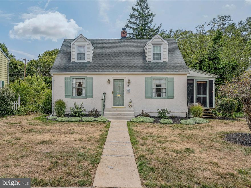 Charming Cape Cod style home has been well cared for over the years!  Lots of living area on main level with newer addition.  Potential for a 3rd bedroom that could be converted easily.  Full bath on main level would make this idea for main level living.   2 bedrooms upstairs and 1 full bath (Hardwood floors under carpet).   Main living level features large living room with wood burning fireplace...side enclosed/screened porch.  Large addition was added in back with extended kitchen.   Newer siding &  gas furnace!!Nice size formal dining room as well.  Improved basement  with access to one car garage.  Alley access offers easy access to garage.  Lovely backyard is a dream with large brick patio areas and fabulous, private backyard.  So much to love about this home.