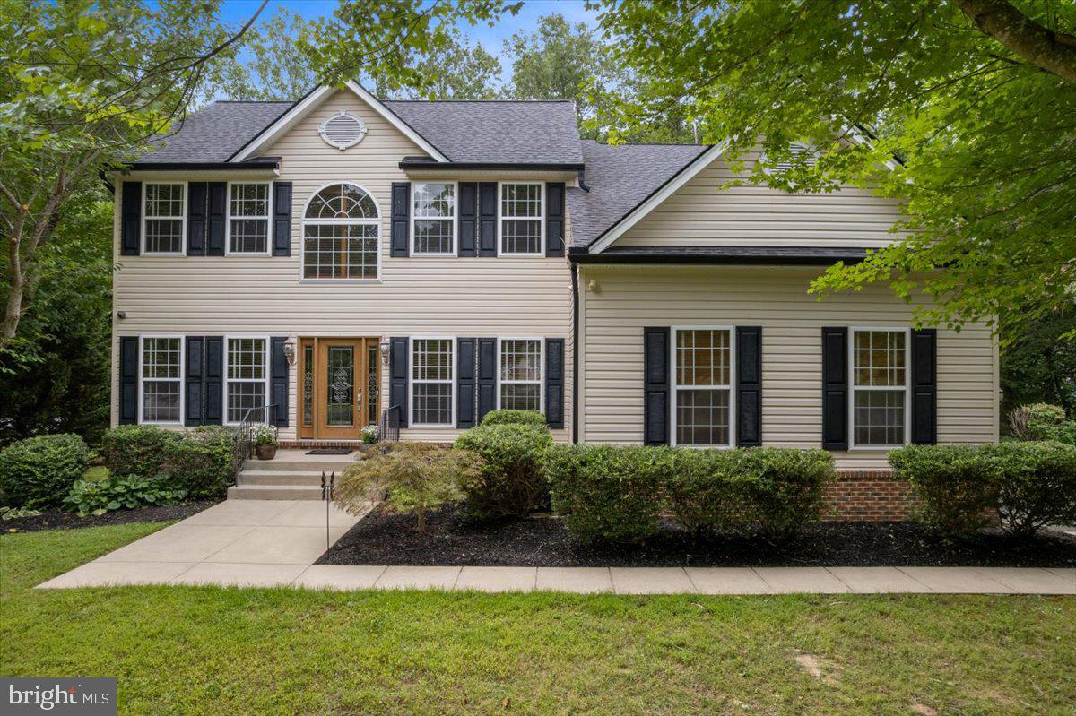 IMMACULATE, CLASSIC COLONIAL IN THE HEART OF HUNTINGTOWN, MD! Welcome to 575 Marley Run, a timeless treasure in one of Huntingtown’s most sought-after communities - Marley Run! This meticulously maintained residence offers the perfect blend of classic charm and modern luxury, all set on a quiet, tree-lined street near a cul-de-sac, ideal for bike rides, evening strolls & safe play.
Step inside the impressive two-story foyer, where gleaming hardwood floors stretch throughout the main level. To the left, a formal living room features beautiful trim detail and sunlit windows, while to the right, an elegant formal dining room sets the tone for memorable gatherings. Continue into the expansive family room, a warm and inviting space highlighted by a tray ceiling, corner gas fireplace with wood mantel & three rear-facing windows framing peaceful wooded views.
The heart of the home is the showstopping, renovated kitchen - designed to impress and built for functionality. Custom upper cabinetry extends to the ceiling, complete with glass-front cabinets that glow with remote-controlled lighting. A massive kitchen island provides extra seating and storage, while quartz countertops and sleek stainless steel appliances make this kitchen a true chef’s dream. The outstanding kitchen features a six-burner gas range with convection oven, a custom range hood, a stainless pot filler, a hidden control dishwasher, an under counter microwave that is built into the kitchen island, a single bowl undermount sink and a stylish tiled backsplash. Don't miss other special kitchen features such as the hidden trash can drawer built into the customized island or the oversized, walk-in pantry! Situated strategically between the kitchen and family room is a custom bar area with quartz countertops & even more customized cabinetry, designed to match the kitchen aesthetic, with two beverage refrigerators and wine storage to complete the entertaining, serving & dining experience.
Step outside through a set of French double doors to the expansive, multilevel composite deck with gas fire table. There is also an electrical hook up for future hot tub install and gas hook up for future grill placement - perfect for outdoor enjoyment as well as admiring the lovely, panoramic wooded backdrop. Back inside, behind the main staircase, you’ll find a private home office with custom built-ins - ideal for remote work or homework!
Upstairs, 4 generously sized bedrooms offer comfort and privacy. The luxurious owner’s suite features a dramatic French-door entry, triple windows, a gas fireplace, and a spacious sitting room. The enormous walk-in closet is a wonder all it's own, measuring nearly 16’x10’ with two sections and includes a built-in laundry chute to laundry room. The owner’s bath also features a double door entry, two separate vanity sinks, a corner soaking tub, a walk-in shower and a private water closet. Additionally upstairs, one of the secondary bedrooms has access to its own private full bath, while the other two bedrooms share a hall bath that includes a sink vanity and shower/tub combination.
Outside, the curb appeal shines with a beautiful, new, wood-finish, glass-lit front door with side lights, plus a two-car side load garage equipped with a smart car charger. Bonus features include a lawn irrigation/sprinkler system, 9’ ceilings throughout the main level, a geothermal heating and cooling system, a whole home water filtration system, added attic insulation, newer roof and gutters (2020), a radon mitigation system, and countless other thoughtful updates within and throughout.
575 Marley Run offers the ideal combination of space, style, and location. Enjoy the peace and privacy of a wooded setting in a picturesque neighborhood, while being just minutes from top-rated schools, shopping, dining, entertainment, and major commuter routes 4 & 2. Don’t miss the opportunity to make this exceptional home your own—schedule your showing today!