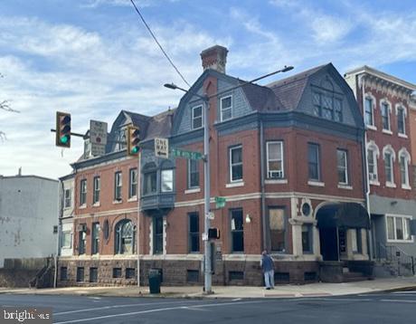 Prime Historic Mixed-Use Property – Sold As-Is
Discover this 6,263-square-foot historic gem, located on a high-visibility corner lot in the heart of Reading's downtown district. Brimming with timeless architectural features, this mixed-use property offers incredible potential for business owners and investors alike. Please note, the property is being sold as-is, providing a unique opportunity to restore and customize to your needs.
Key Features: Corner Lot Location: Unmatched visibility with high foot and vehicle traffic, ideal for businesses seeking maximum exposure.
Versatile Space:
Commercial Space: The spacious ground floor features large display windows, perfect for retail, office, or service-based ventures.
Residential Units: Two upper-level apartments provide income potential or space for live-in tenants.
Historic Elegance:
Intricate Woodwork: Stunning moldings and hand-carved details throughout.
Mosaics & Beveled Glass: Original, eye-catching mosaics and beveled glass windows reflect timeless sophistication.
Fireplace: A stately fireplace adds warmth and charm to the interior.
Architectural Moldings: Original period details highlight the property’s historic character.
Proximity: Located within walking distance to shops, restaurants, government offices, and cultural landmarks.
As-Is Sale
This property is being sold as-is, allowing the buyer full creative freedom to restore or renovate. While some updates may be needed, the potential of this historic property is limitless.