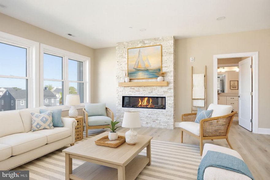 Boat Slip included with Purchase for Limited Time !! Absolutely Stunning Villas MOVE IN READY in Ocean City! This MOVE IN READY Villa showcases an open concept perfect for entertaining! LVT through the main living areas set the tone for the tastefully designed space. Let's get cooking! Stainless Steel Appliances, White Kitchen Cabinetry with Soft Close, Quartz Countertops, Recessed Lighting, and an Electric Stove make cooking and cleanup a breeze! With so many amazing places to enjoy your meal, Morning Breakfast/ Brunch in the Dining Area or Kitchen Island, Relax with Morning Coffee on the Deck overlooking the Beautiful Bay Views. Time to unwind and Snuggle up for a movie by the Fireplace after a long day soaking in the sun. Primary Suite Boasting Walk in Closet, En - Suite with Soaking Tub, double vanity and access your private Deck.  This sprawling Villa Showcases 3 Other Bedrooms and 3 Full Baths. Not that you should ever need to leave this amazing Space but if Sunshine is what you are looking for... Take in All Ocean City has to Offer with just a short Walk to all the Major Attractions. Headed back from the beach and don't want to bring the sand inside? Rinse off in the Outdoor Shower. Covered Parking to keep your car cooler on those hot summer days! Take Advantage of dock access to our Private Boat Slips with Electric & Water available with purchase for a limited time! Welcome Home to Son Ray Villas! ** Furnished Unit Options Available. Intertior Photos Virtually Staged.