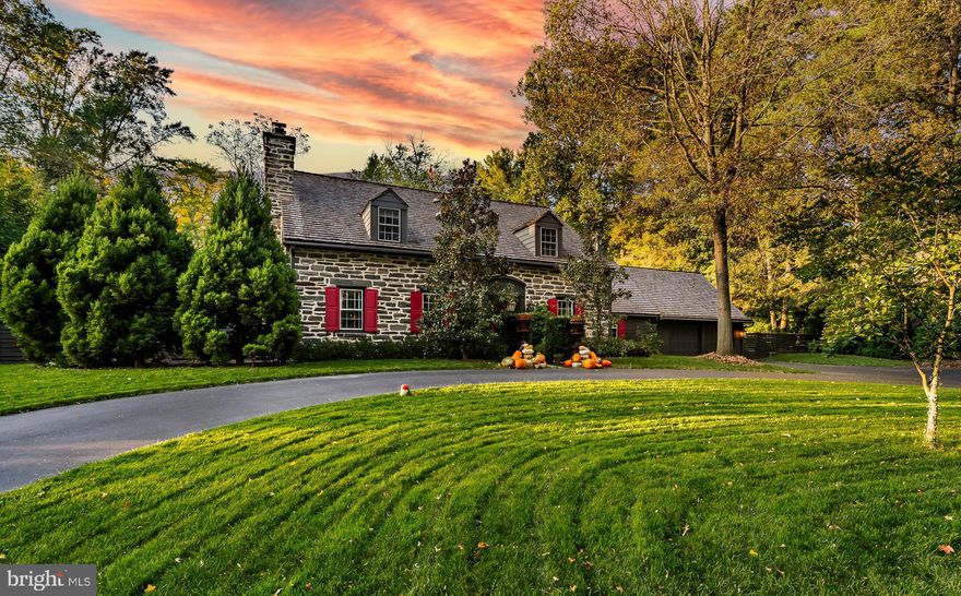 This sophisticated 3 to 4 bedroom, three and one half bath stone home, features a bonus suite (separate room and full bath with private outside entrance as well as connection via the Primary Suite) which could be ideal as an au pair/guest/office suite, and sits on a lushly landscaped .93 level acre. As you step inside, a classic foyer sets the tone for the entire home. The elegant living room, complete with hardwood floors and a cozy fireplace creates an inviting atmosphere for both entertaining and unwinding with loved ones. The Dining Room allows access to a private covered patio. The heart of the home, the kitchen, thoughtfully designed by Petersen Kitchens, boasts a show-stopping Carrara marble waterfall island, Plato Cabinets, top-of-the-line Wolf & Subzero appliances, and an abundance of well designed cabinet space. The family room, an extension of the kitchen, features cork flooring and a second wood-burning fireplace. Ample closet space and first-floor laundry add to the functionality of this room. Convenience meets productivity with a home office on the main level as well, catering to remote work or offering a serene study nook. A convenient powder room completes this floor. 

Upstairs, the spacious primary bedroom awaits, complete with a bright en-suite bathroom with heated marble flooring and a shower. A delightful sitting room adjoins the Primary bedroom with a full wall of closets. The bonus suite, accessed behind a opening bookcase in the sitting room, features an additional full bathroom with tub and is drenched in natural light, and boasts an exterior private entryway, makes it an ideal guest suite, in-law quarters, au-pair suite, or home office. Two additional well-sized bedrooms and a full bath complete this level, along with a linen closet and attic access. The partially finished basement offers ample storage and the potential for your own custom finishing touches. A true highlight of this property is the spectacular yard! The deep set driveway leads to an attached two-car garage and parking yet allows guests to exit at the front door and leave the property via a gracious semi-circle. 

The backyard features an expansive slate patio with gardens and specimen plantings galore, the previously mentioned covered side patio, as well as an abundance of open space, creating a lovely oasis. The fenced yard ensures both privacy and security. The home has been beautifully maintained, including a new cedar shake roof in 2021 and a whole house generator. Walk or drive 4/10 of a mile to the village of Gladwyne and you’ll find many daily conveniences such as The Gladwyne Market and brand new McCaffrey’s Market, as well as the popular dining spots Home Room and The GuardHouse. Gladwyne Hardware, the post office, dry cleaner, library, pharmacy, salon, veterinary services, parks, walking trails, public and private schools and churches are additional amenities. Quick access to major thruways to Philadelphia, King of Prussia and other destinations. This location is truly the best of both worlds: the serenity of an idyllic retreat while mere minutes to other vibrant Main Line towns and not too far to the bustling heart of Eagles and Phillies land! This stunning residence truly has it all. Don’t miss the opportunity to make it yours. Schedule your private tour today and experience the magic of this exceptional property!