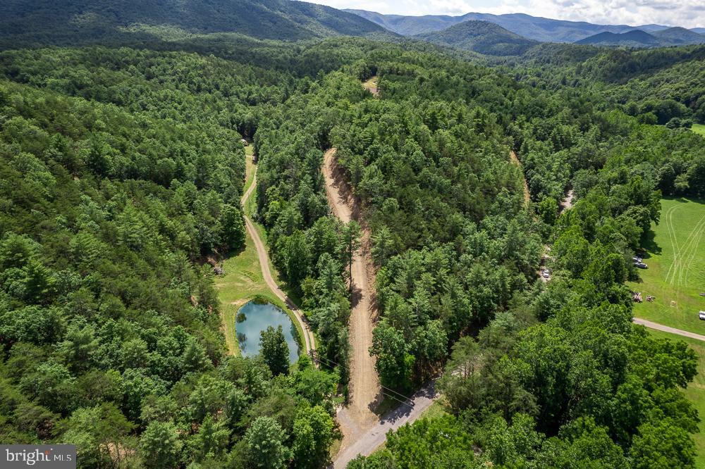 If you are looking for acreage for hunting and perfect for building your primary home or your cabin, look no further! This fantastic approximately 22.9 acre property boasts excellent hunting with deer, turkeys, bear in abundance, a wet weather stream, partial ownership in a stocked pond. Two deeded ROWs. Property has been "witched" for a well and perced for conventional septic (permit not requested). Electricity and Frontier internet/phone nearby access. WVDOT permitted entrance. Property derived from 2 parcels. Survey to be completed by seller prior to settlement. Annual taxes approximately $462. Don't miss out on this slice of Almost Heaven very near to the National Forest, Brandywine Lake, and public river access points for all of your outdoor enjoyment and minutes from shopping and dining. Peace and quiet in this private location awaits!