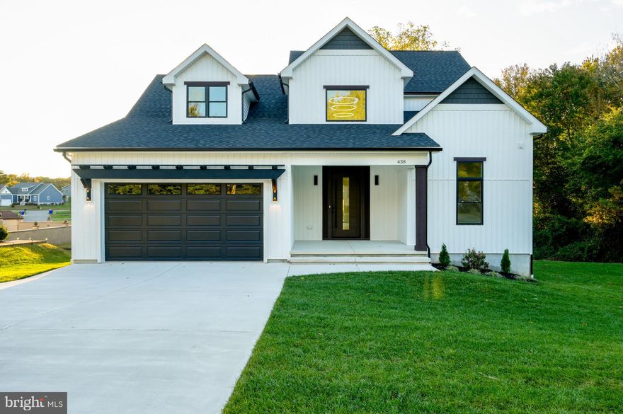 438 Delaware Ave, Millsboro, DE 19966Built by WN Builders, Inc. | Ready to Move In | Buyer’s Agent Friendly Experience modern luxury and thoughtful craftsmanship in this brand-new WN Builders home, located in the quiet Old Landing community of Millsboro. Just minutes from Delaware’s beaches and outlets, this property offers the perfect combination of comfort, elegance, and convenience.With 2,484 sq. ft. of finished living space (plus a 260 sq. ft. unfinished bonus room and 500 sq. ft. garage), this home sits on a 0.34-acre lot with a glimpse of Betts Pond — an ideal setting for peaceful mornings and relaxing evenings from your 288 sq. ft. rear deck.*** Interior HighlightsSmart Home Package: pre-wired for cameras, speakers, and voice-assistant controlDesigner kitchen featuring KitchenAid appliances, soft-close plywood cabinetry, quartz countertops, and a large oak-slatted islandElegant two-story foyer and 11’ high-ceiling study with chandelier and modern ceiling finishOpen-concept living area with propane fireplace and custom modern mantleFull tile-to-ceiling showers in all bathroomsUpgraded master suite with wall-trim accents and spacious walk-in closetsLaundry room with sink and butcher-block countertop over washer/dryerMudroom with built-in bench and hooks for drop zoneFormal dining area with detailed trim workSolid oak stair treads and TV connections in all bedroomsCrawl space with 2” concrete slab, French drain, and full insulation for added comfort***Exterior FeaturesUpgraded mahogany front door and insulated garage doorFull-yard irrigation system and professionally installed sodRear deck with a glimpse of Betts PondFront porch with 146 sq. ft. of covered spacePublic sewer and public waterExcellent location near grocery stores, medical facilities, and the new Millsboro infrastructureThis 2025-built home is ready for immediate move-in and is being sold directly by the builder — no waiting, no surprises.Old Landing Community |
