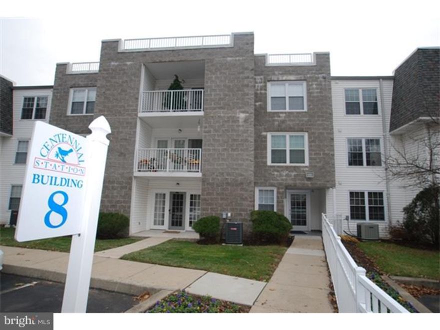 Expanded upgraded condo with private entrance from patio/parking lot. New Carpets! Huge Condo in great condition At Centennial Station (55+ Housing). Largest condo available other than a penthouse.  Extremely generous room sizes and very bright/cheery. Dry walled ceilings in entertaining areas instead of ceiling tiles. Multiple extra hi hats. Ceramic foyer and kitchen. Ceramic enlarged patio. No condo fee increase from 2013 to 2014! No special assessments coming down the pike! Condo fee includes Comcast cable, security monitoring, trash, snow, water, sewer, etc.   All that and it's located in A Building That Is Right Across from the Extensive Activity Center Including Indoor Year-Round Pool, Exercise Room, Craft Room (With Kiln), Card Room, Billiard Room, And Meeting/Banquet Room. Commercial Wing Of Activity Center has Real Estate Office, Restaurant, Hair Salon, and Dentist. This Home Combines The Ease Of Condo Living With A Floor plan That Could Have Come From A Rancher Complete With separate Dining Room. Construction Features  Solid Concrete/Cinder block Construction, Sprinkler System, Security System. Once tax assessment is appealed, taxes should drop to approx. $3,400.