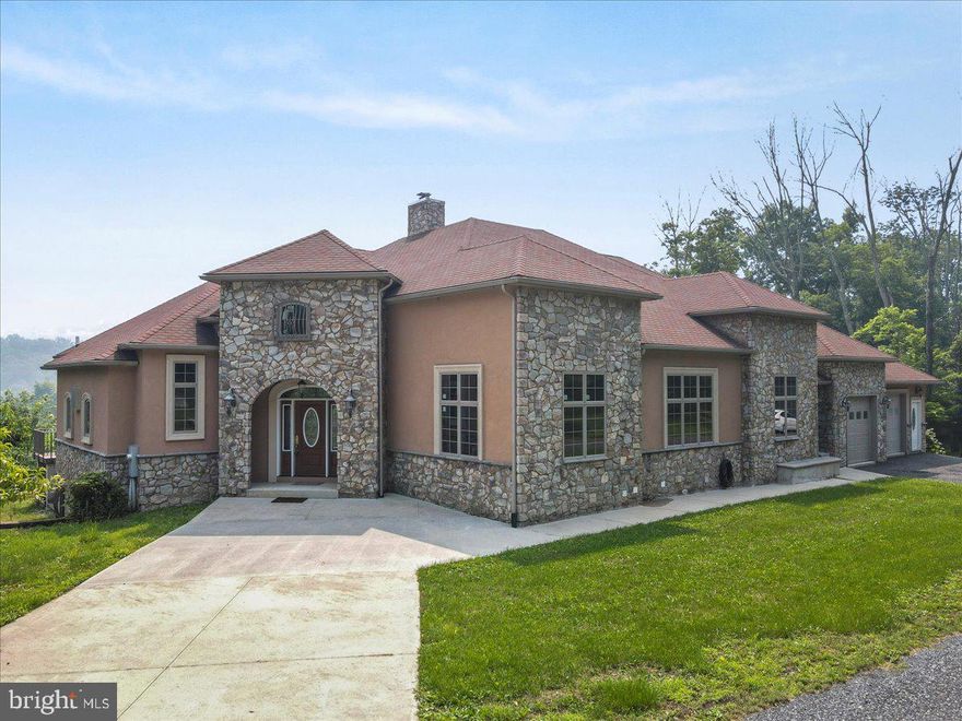 This magnificent villa sits on an expansive 47-acre property & exudes luxury at every turn. You'll be greeted by the grandeur of the Great Room featuring dramatic ceilings & columns that invite natural light in. The centerpiece is a stunning large stone fireplace w/ pellet stove. The gourmet kitchen is a chef's dream: cherry cabinetry, an Italian stove, convenient wet bar, expanded island & an extra-large pantry to store all your culinary essentials. The patio extends the entire length of the home. Prepare to be pampered in the luxurious master suite featuring a private balcony, marble finishes & his-and-her walk-in closets. Indulge your passion for wine in the winery. The separate garage offers 4 bays w/ oversized doors providing ample space for vehicles, workshop area & a private bath that can be transformed to suit your desires. This villa is a true masterpiece offering a harmonious blend of elegance & comfort. Don't miss the opportunity to make this extraordinary property your own!