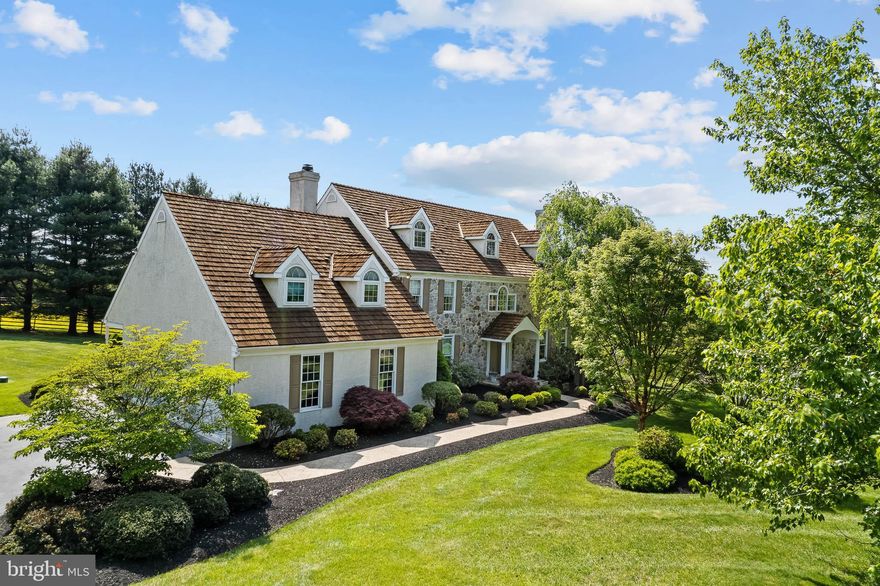 A GORGEOUS HOME and TRANQUIL SETTING! Welcome to this Merit award winning custom built,  4 Bedroom, 3.3 Bath home, located within the state and nationally, highly ranked UNIONVILLE CHADDS FORD SCHOOL DISTRICT. Enter into the Foyer with an elegant spiral staircase and atrium window. There are beautiful natural hardwood floors which run throughout most of the first floor. To the left is a well appointed Office with crown moulding. To the right is a spacious Living Room also with crown moulding, built in shelving, and an incredibly elegant centerpiece fireplace with two separate door entrances leading out to a cozy Balcony, perfect for watching and enjoying sunsets. The Living Room flows naturally through to the Dining Room which showcases a royal tray ceiling, wainscoting and two large windows. The KITCHEN is OPEN & BRIGHT featuring: Quartz Countertops, 2-tier large Breakfast Bar, Stainless Steel Appliances, Subzero Refrigerator, Tile Backsplash, Double Oven, Recessed Lighting, Gas Cooktop and an absolutely adorable Built-in Shelving cabinet!!  A beautiful compliment to the kitchen is the bump-out, bow shaped morning room, with surrounding windows and a glass door leading to an expanded wood composite TREX deck.  All you have to do is follow the windows and you will see the kitchen gracefully opens into the spacious Family Room.  The Family room is grand with a floor-to-ceiling Stone Fireplace and a 2-tier tray ceiling along with beautiful new French doors which also opens to the deck. Also, 2 Half Baths located on the First Floor, with one conveniently located near a side-porch entrance to the home. The UPSTAIRS is accessible via 2 staircases, and features 4 bedrooms along with an extra-spacious BONUS ROOM that can be easily converted into a "5th BEDROOM." The Main Bedroom features another 2-tier tray ceiling with fan, an incredible bump-out sitting room with wall-to-wall windows including pocket glass doors for privacy, his and her oversized walk-in closets, and a separate vanity.  The Main Bathroom features custom countertops with a double sink, soaking jacuzzi tub, tile floor and a two-headed oversized shower. Three other spacious Bedrooms & two full Baths, one ensuite, complete the rest of the upstairs, all with generous walk-in closets, lots of light and custom countertops. The FINISHED WALK-OUT LOWER LEVEL  makes for a family’s dream.  It includes as entertainment area, perfect to gather around and watch the big game. It also includes plenty of additional space to use as you see fit. Keeping with the Main and Upper level, the bump-out window room allows for additional space and lots of light making the room absolutely sunny, stunning, and bright. Also, there is an additional Half Bath, with granite counter tops, along with a large section walled off for additional storage. The LOT is STUNNING! Sitting on 1 acre of level ground with beautiful views of the horse farm where they filmed the movie "Marley & Me," the setting is not only a visual oasis, but a truly ideal space for kids to run around and enjoy. The TREX DECK oversees the peaceful setting with an electric-powered Awning with drop-down screen shade. Additionally, a 3-Car garage with bump-out space! This home comes equipped with 2-zone heat and air systems! All this and more on a PRIVATE cul-de-sac street, you will find a TRUE CHESTER COUNTY GEM!