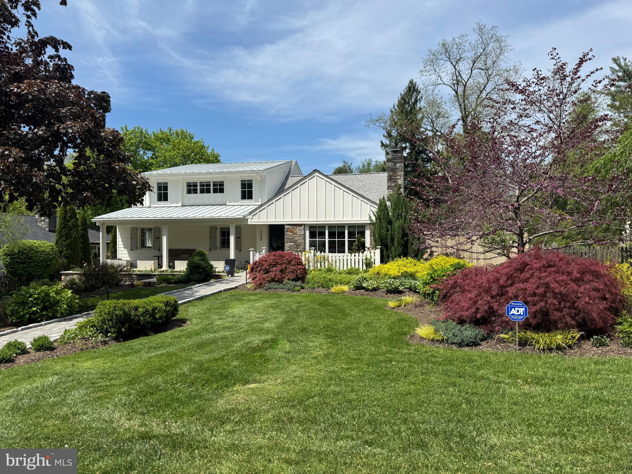 Modern Classic Cape… Reimagined by Bergman & Vass!
Nestled in one of Lower Merion’s most desirable neighborhoods, this stunning modern classic Cape Cod-style home has been completely rebuilt and masterfully redesigned by renowned architectural firm Bergman & Vass. Blending timeless charm with contemporary sophistication, every inch of this residence showcases thoughtful design, top-of-the-line finishes, and unparalleled functionality.
Step inside an entry that flows seamlessly into the dramatic great room featuring a gas fireplace, perfect for cozy evenings or elegant entertaining. The heart of the home is a state-of-the-art kitchen, complete with a striking quartz island, high-end appliances & custom cabinetry. The kitchen opens to a sunlit breakfast room with a soaring vaulted ceiling & expansive windows, creating a warm, inviting atmosphere & bringing the outdoors in. Sliding doors lead to a bluestone terrace beneath a pergola, ideal for al fresco dining & relaxing outdoors.
Adjacent to the kitchen, the fully equipped scullery offers extensive cabinetry, a refrigerator/freezer, double wall ovens, a built-in microwave cabinet, & a prep sink an entertainer’s dream. A spacious laundry room with a deep sink & garden access adds everyday convenience.
The first-floor primary suite is a serene retreat featuring a luxurious walk-in closet & spa-like master bath with premium fixtures. A second bedroom on this level is served by a beautifully appointed hall bath with a stall shower.
Upstairs, two generously sized bedrooms share a full hall bath with a tub/shower, while a private office provides the perfect space for working from home.
The walk-out lower level expands the living space with a large family room, game room, half bath, oversized walk-in closet, utility/storage room, & a second refrigerator/freezer. Direct access to the oversized two-car garage includes a built-in electric car charger plus loads of extra storage.
Outside, professionally landscaped gardens, refined hardscaping, exterior lighting & a stone fire pit create a magical outdoor oasis plus a whole house generator. Interior highlights include, white oak flooring, designer lighting, a built-in ice maker & smart home features throughout.
This exquisite home offers total privacy & tranquility, yet is just minutes from Center City Philadelphia, & all major roadways. Award winning Lower Merion schools, shops, fine dining & R-5 train to Center City! A rare opportunity to own a fully re-imagined classic in an unmatched location.