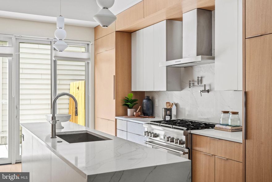 New construction townhome with 2-car deeded parking in Fitler Square. This corner property with south-facing windows was thoughtfully designed with high-quality materials, a generous floor plan, dedicated parking available, and sweeping skyline views from oversized windows and a private rooftop terrace. This thoughtfully laid-out floorplan offers flexibility and convenience, featuring four bedrooms, four full bathrooms, and a half bathroom across four levels of living. The first-floor open-concept design seamlessly integrates the living room, dining area, and kitchen. The gourmet kitchen features quartz counters, Thermador appliances, custom cabinetry, and a built-in pantry, along with glass sliding doors that provide direct access to two deeded parking spaces. Also on the first level is a conveniently located powder room. This property's second level comprises two guest bedrooms with spacious closets, a laundry room, a hall bathroom with a tub/shower combo, and a single vanity sink with storage. The primary bedroom suite spans the entire 3rd level of the property, highlighted by a massive walk-in closet and spa-like bathroom with dual custom vanities, a stand-alone tub, a seamless glass shower, heated tile floors, and a water closet with a Toto Neorest. The fourth level is open and spacious, featuring a home office/guest room, a hall bathroom, and an open media room/den with a wet bar, which includes a built-in beverage cooler. Above is the private roof deck with panoramic views of the Philadelphia skyline. Completing this home is a fully finished lower level with a guest bedroom, hall bathroom, and rec room -- perfect for a den/home gym/playroom. 10-Year Tax Abatement (Phased) approved & included!

Located in Fitler Square and adjacent to Rittenhouse & Graduate Hospital neighborhoods, this property is located in the Greenfield school catchment and surrounded by fantastic eateries, coffee shops, and city conveniences while being only a short commute to Penn, CHOP, 30th Street Station, and the businesses in Rittenhouse Square.