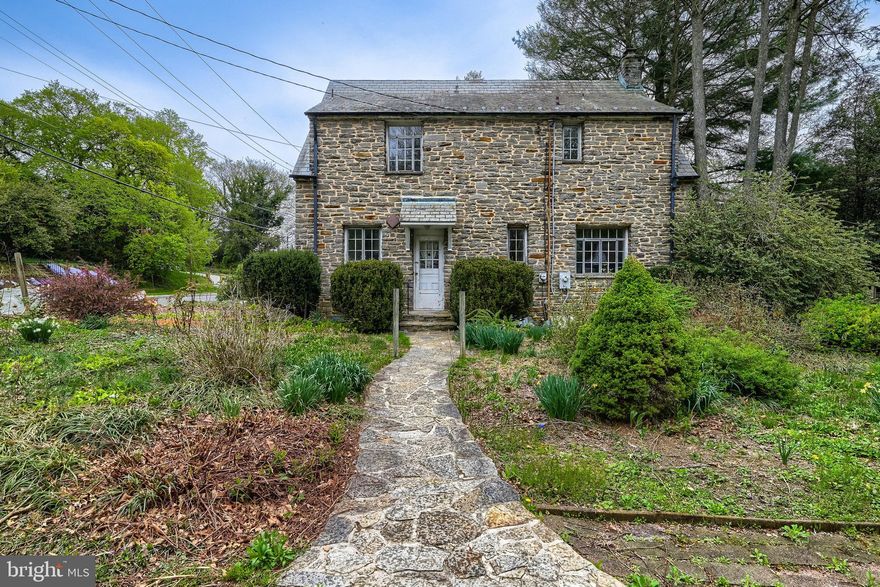 Developer opportunity.  6580 Loch Raven Blvd sits on approximately 1.5 acres in the Stoneleigh Elementary School district, with the possible opportunity to develop multiple homes on the lot.  
The main house also offers a unique chance to renovate a beautiful stone home.
The main residence features 3 bedrooms and 1.5 baths, along with an unfinished basement spanning the full footprint of the home. Original details include a slate roof and classic metal casement windows. A separate, permitted cottage provides 2 bedrooms, 1 bath, and approximately 500 square feet—ideal for guests, extended living, or additional flexibility.

Situated on approximately 1.5 acres, the property offers ample outdoor space and possible future opportunities.  Being sold As-Is . 

Seller believes the land may be suitable for development; buyers are encouraged to conduct their own due diligence regarding zoning and permitted uses.