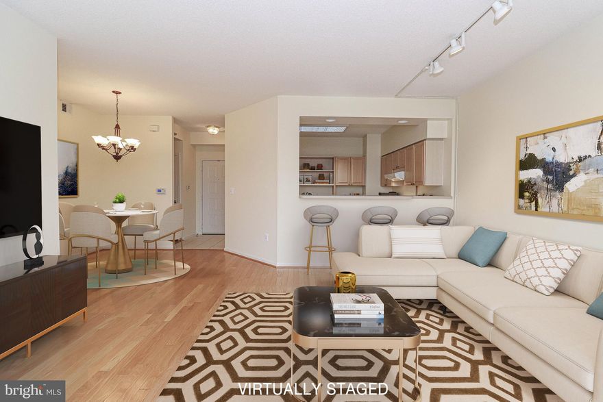 Beautifully updated and professionally cleaned - completely ready for move in! This warm and inviting condo half way from the elevator greets you with beautiful views. The whole unit has been freshly painted, all new carpet installed, hardwood living and dining, new furnace and A/C (2020). The spacious living room and the open floor plan provide comfortable living space, plus you will love relaxing in the enclosed sunroom. The primary bedroom offers a large walk-in closet with a custom shelving system, and an additional closet as well. The second bedroom also has its own bath, ensuring privacy and ease. There is plenty of storage, and a dedicated storage unit. This building is well known for the beautiful lobby, renovated hallways, the game room with the library with its own kitchen, and the fantastic balcony overlooking the woods and the creek. You will love the world class amenities that Leisure World offers for the residents