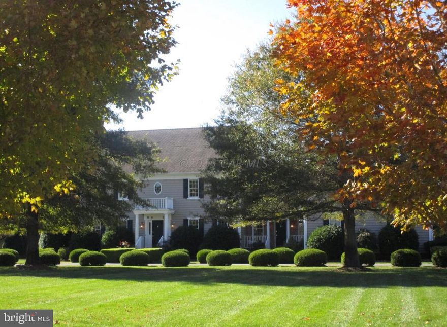 Enjoy the Gorgeous sunsets from this waterfront Colonial home on 2 acres with boat dock/lift. Beautifully landscaped in a peaceful setting on Trappe Creek. This home has it all: a formal living room, dining room, family room with fireplace, Florida room,library w/wet bar, walk-in attic & geothermal heating system. The adjacent property (2 acres waterfront )for sale ($399000). Currently a 2 story "carriage house" with 4 bays, partially completed as a residence.