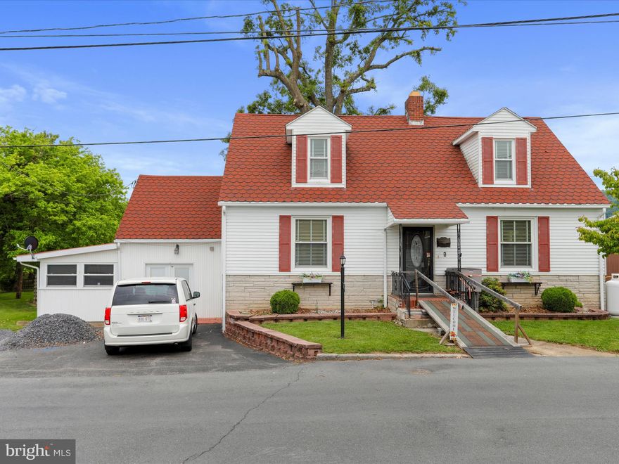 New List Price! Recent upgrades/renovations. The home has been modified for handicap accessibility. This classic Cape Cod-style home is nestled in the heart of Romney WV-walking distance to downtown main street. Offering both timeless charm and modern amenities. With three bedrooms and two baths, the home provides ample space for comfortable living. The traditional layout includes an eat-in kitchen ( recently remodeled), perfect for casual meals and family gatherings, as well as a family room, den/study, and a separate living room complete with a cozy fireplace, ideal for relaxing or entertaining guests.  The upstairs bath has been renovated with an LED mirror and a walk-in tub.
Convenience is key with a main level laundry room, and an unfinished basement for ample storage or potential for customization according to your needs. Step outside to enjoy the screened-in back porch, patio, and fenced-in yard, providing private outdoor spaces for enjoying the fresh air.
This home has been thoughtfully upgraded, with updated electric and plumbing ensuring peace of mind. The dual Trane systems provide efficient heating and cooling, while the tile roof and replacement windows contribute to both aesthetics and energy efficiency.
Situated in the heart of Romney, residents have easy access to Hampshire Memorial Hospital, schools, shopping centers, and a variety of dining options ranging from quaint diners and grills to charming country stores and boutiques. Additionally, the nearby Potomac Eagle Scenic Railroad offers a unique way to explore the scenic beauty of the area. Experience the best of small-town living in this delightful Romney residence. All sizes are approximate.