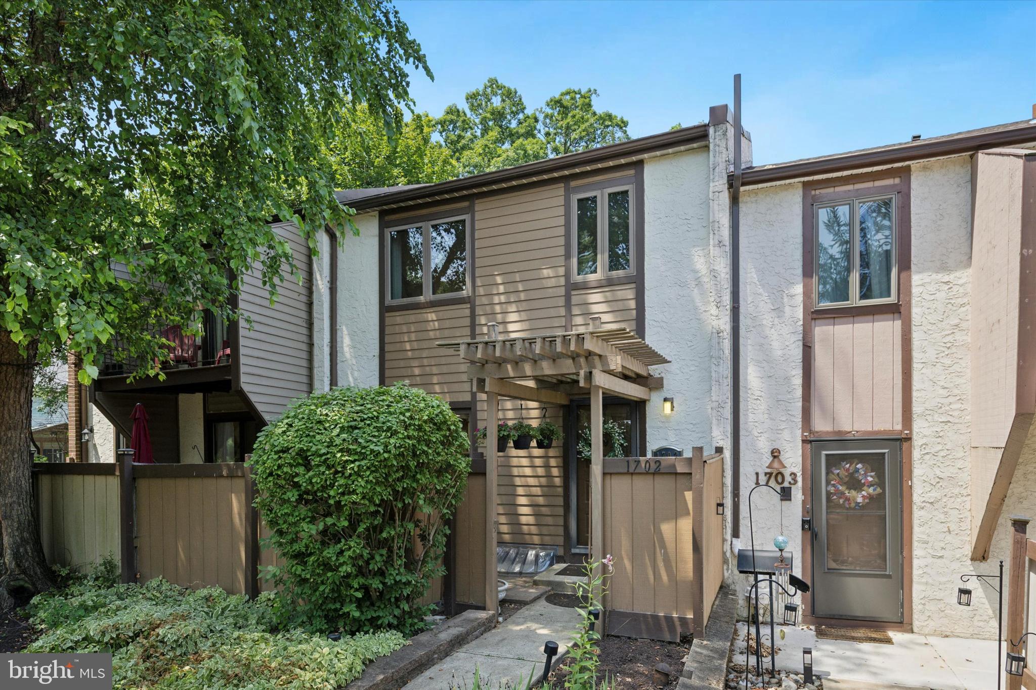 Move in ready, prime location and low maintenance are just a few reasons why you want to make 1702 Linden Way your new home! This multi-level townhome in Prussian Woods offers amazing space and tons of updates. As you enter, the updated kitchen is to your left. Tons of cabinet space, great counter space, new appliances, space for a breakfast area and access to a quaint patio for BBQs and relaxing. A formal Dining Room and powder bathroom complete this level. This home is uniquely designed with versatility in mind, offering two spacious family rooms situated on different levels.  The upstairs family room offers great light from the sliding doors that take you outside offering serene views of trees and open space. The lower family room boasts a cozy brick fireplace and sliding doors to a more expansive deck, crafting an ideal backdrop for entertainment or relaxing. A few steps down is a finished basement- great as a workout room, office or playroom. There's also a mechanical room and crawl space for more storage. Back upstairs are 3 bedrooms. The primary suite includes 2 closets and ensuite full bathroom. The 2 spare bedrooms are great sizes, with a hall full bathroom and convenient laundry space. Noteworthy updates included a new roof, new HVAC, fresh paint, new light fixtures, new carpets. Located mere minutes from the King of Prussia Mall, Wegmans, and major highways such as Rt 202, 76,476, and the turnpike, this townhouse combines luxury living with ease of access to all life's necessities.
