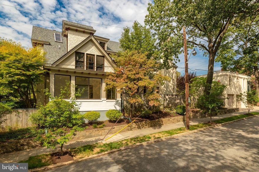 Rare opportunity to own a significant 1907 property in historic Cleveland Park.  Overlooking the grounds of neighboring Twin Oaks Estate, the property is sited on a lovely fully fenced lot above street level affording it complete privacy.  Renovated and expanded by Michael Minkoff for the current owners, the Victorian Renaissance-style residence retains the charm of early Cleveland Park while offering contemporary features and updates for today's lifestyle.  The sun-bathed residence has a large living room, sunroom, formal dining room, gourmet chef s kitchen with family room opening to rear patio, five bedrooms, and four- & one-half bathrooms, and an unfinished basement with 600 bottle wine cellar.  Both private front and rear yards offer flagstone patios and extensive landscaping.  The exceptional property is completed by a detached over-sized 2-car garage that features a spacious loft-like studio above with a kitchenette, full bathroom, and its own heat/AC/water.  Truly a unique and rare offering.  CO-LISTED: Jane Howard