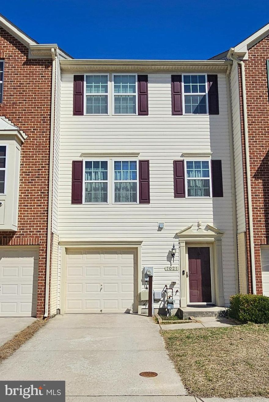 Welcome to 7021 Ingrahm Drive in Glen Burnie, located in the sought-after Tanyard Springs community! This well-maintained 3-bedroom, 2.5-bath townhome with a one-car garage backs to a lush green common area.
The main level features an open-air plan with spacious living and family room areas, perfect for everyday living and entertaining. The kitchen includes granite countertops, recessed lighting, hardwood flooring, and a center island with extra storage. The dining area opens to a rear Trex deck, creating a great outdoor space for relaxing or entertaining.
Upstairs, the primary bedroom offers a walk-in closet and private en-suite bath, while two additional bedrooms share a full hall bath.
The finished lower level with new LVP flooring provides flexible space for a recreation room, home office, or additional living area, along with a laundry area and access to the garage.
Tanyard Springs amenities include a clubhouse, pool, fitness center, playgrounds, dog park, and walking trails, with convenient access to Fort Meade, BWI, Baltimore, Annapolis, shopping, dining, and major commuter routes.