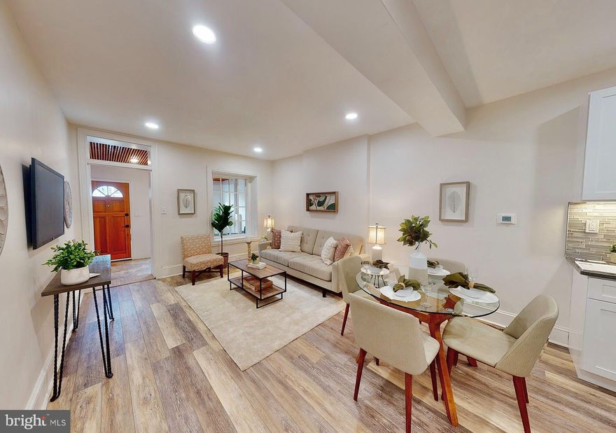 This home captures your attention, from the vibrant exterior color scheme to the interior layout and amenities. Just behind the stone wall that frames this home, you will find a welcoming patio. A perfect space to greet your guests or sit back and enjoy the breeze and view of the Schuylkill River. As you open the bright and sunny front door, you enter the sitting area with ceramic tile flooring and slatted wood ceiling with recessed lighting and framed by two sixteen light windows. The open floor plan of this home lends itself to an abundance of layout possibilities. The kitchen offers granite countertop, shaker style cabinets, tile backsplash, stainless steel appliances such as a five-burner gas stove with center griddle, side-by-side refrigerator, dishwasher, and built-in microwave. Just off the kitchen, you will find a mudroom and combination powder and laundry room with front loading washer and dryer. The rear patio area is fully fenced and is a great place to fire up the grill and have plenty of space to start your very own urban container garden. On the second level, you will find a three-piece hall bath with ceramic tile flooring and tub surround, two spacious bedrooms with ceiling fans, and the front room with double wall closets. The top floor is where you will find the primary bedroom with walk-through closet and connecting bathroom completed with lighted vanity mirror, black-framed stall shower with ceramic tile surround, and hexagon floor tile. Additional amenities in this home include NEW Roofs (2020), NEW windows (2020), NEW HVAC (2020), NEW siding (2020), NEW Kitchen (2021), just to name a few.  East Falls is a unique community nestled along the banks of the Schuylkill River. It boasts an Urban-Suburban lifestyle and is centrally located for an easy commute to both Center City and the Suburbs. It is close to major roadways or if you prefer to not drive the regional rail line is just a block away. This neighborhood is surrounded by parks, trails, and of course, the Kelly Drive recreational loop which is within sight of this home's front steps. Pop into the Falls of Schuylkill Library and bask in its Collegiate Gothic architecture while checking out some of your favorite authors. McMichael Park is another neighborhood favorite with six acres of open space including the NEW natural play space. Do not forget to stop and enjoy one of the many restaurants, bistros, saloons, shops, or cafes that are located in this marvelous community, including Billy Murphys, Fiorino, Wissahickon Brewery, Thunder Mug, Vault and Vine, NouVaux Market, Shan Chuan, The Black Squirrel Pub & Haunt, and LeBus just to name a few. Do not take my word for it, come see for yourself.