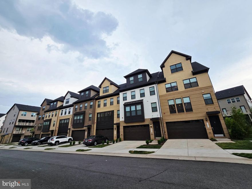 Discover luxury living in this stunning corner unit townhouse in The Boulevards at Westfields featuring  Bennington II model by K. Hovnanian, built in 2023 with 5 bedroom, 4.5 bathrooms that perfectly blends elegance with comfort. This premium corner location provides additional windows and natural light throughout. The heart of this home is the gourmet kitchen, featuring top-of-the-line appliances and a spacious gourmet island ideal for both everyday living and entertaining guests.  Unwind in the bright and airy sunroom, perfect for morning coffee or evening relaxation. Step outside to the impressive 2-storydeck that offers exceptional outdoor living space and entertainment possibilities with scenic views.  The corner unit positioning provides enhanced privacy and additional outdoor space.