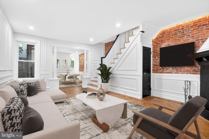 Welcome to this stunning, fully renovated row home in Philadelphia’s Cobbs Creek neighborhood. Thoughtfully designed from top to bottom, this spacious 4-bedroom, 3-bathroom home is move-in ready and filled with stylish finishes, spacious living areas, and historic character throughout. 

Enter into the bright and airy sunroom, featuring large windows and built-in shelving—perfect for a cozy reading nook or indoor garden space. From there, flow into the inviting living room adorned with parquet hardwood floors, an exposed brick wall, and a fireplace that anchors the space beautifully.

The formal dining room is spacious and perfect for hosting, while the adjacent kitchen is a true showstopper—featuring checkerboard tile flooring, quartz countertops, modern shaker cabinets, stainless steel appliances, and plenty of counter space for meal prep and entertaining. In the  kitchen you'll find a back staircase leading to the upper level, enhancing the home’s flow and functionality. The kitchen also offers access to the private rear patio, ideal for outdoor dining or relaxing on warm summer evenings.

Upstairs, the primary suite offers a peaceful retreat with three large bay windows, two closets, and a luxurious ensuite bathroom showcasing checkerboard tile flooring, rich green tiled walls from floor to ceiling, a walk-in shower, and elegant gold accents throughout.

The upper level also features three additional generously sized bedrooms, perfect for family, guests, or home office needs, and a beautifully designed full hallway bathroom. This bathroom features a white subway tile tub/shower combo, a black-tiled glass stall shower, sleek white vanity, and matte black fixtures for a modern black-and-white theme. 

Continue down to lower level where the partially finished, walk-out basement adds even more flexibility to this home. Here you'll find the laundry area, a third full bathroom featuring white subway  tile and a tub/shower combo. The basement’s spacious open layout is perfect for a home gym, recreation room, storage, or flex space to suit your needs.

Throughout the home, enjoy a seamless blend of old and new: original hardwood floors, stained glass windows, and vintage hardware are complemented by modern lighting, exposed brick, wainscoting, chair rail trim, and box molding, adding sophistication and character to every room.

Located just steps from public transportation, neighborhood shops, restaurants, and minutes from the lush trails of Cobbs Creek Park, this home offers the best of city living. Don’t miss the opportunity to call this one-of-a-kind Cobbs Creek residence your new home—schedule your private showing today!