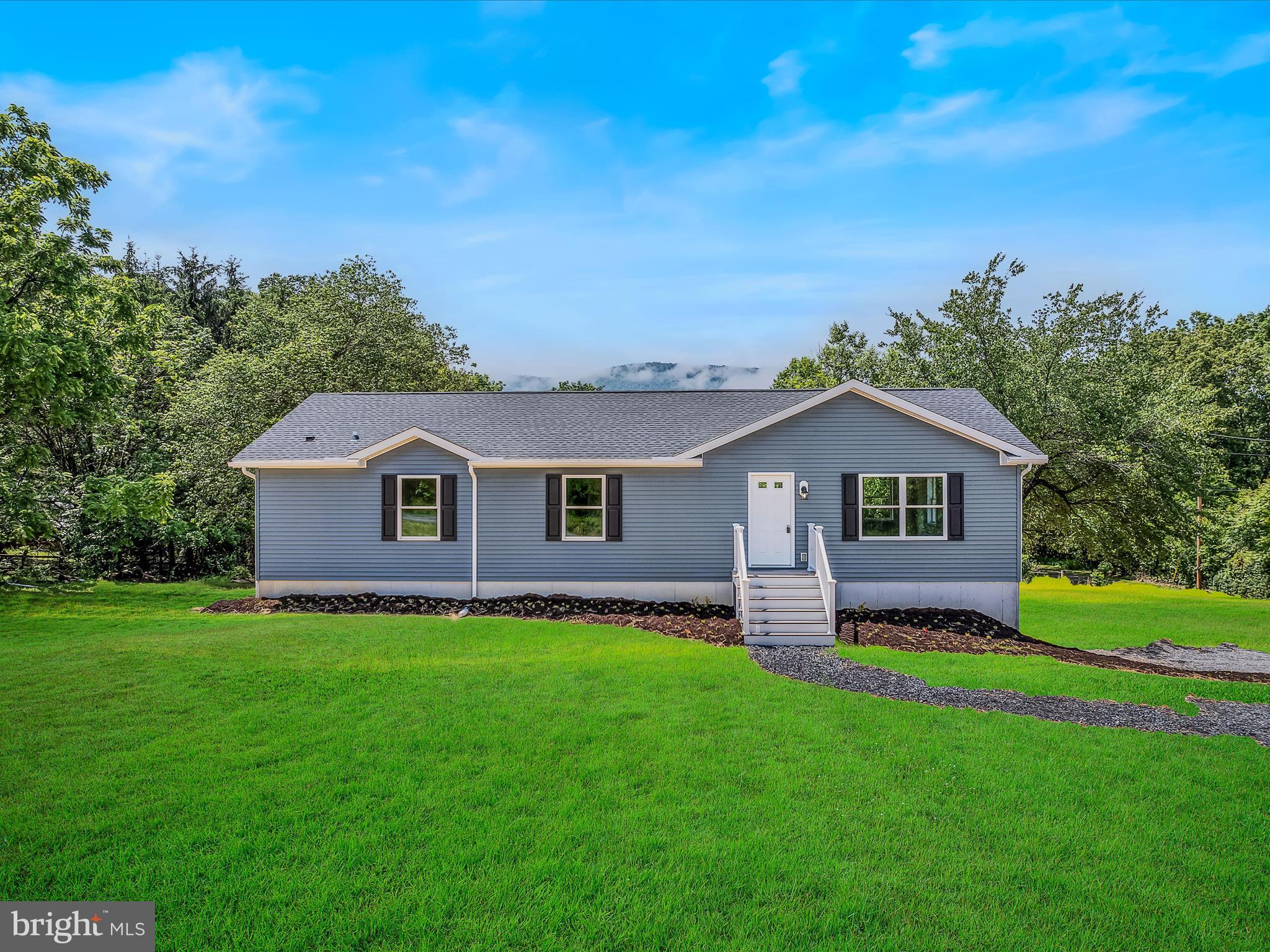 GREAT LOCATION: don't miss this New 3-bedroom 2-bathroom rancher just a mile off US 522 for easy access to surrounding areas. This home has an open Kitchen/Dining/Livingroom floor plan for plenty of room for the family get together. Main floor laundry for one floor living. Home has a 25x54 unfinished basement area that can be completed the way you choose for more living space. Basement has been roughed in for a 3rd bathroom. Mountain view from rear of home. Rear deck options available. Just a few miles from Cacapon State Park for the enjoyment of hiking, swimming, boating, fishing, golfing and even horse-back riding.