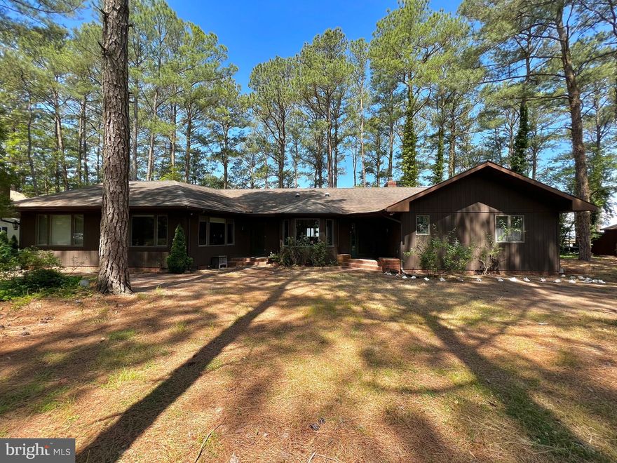 Waterfront 3 bed 2 1/2 bath home located only a few minutes sail from the Chesapeake Bay's Tangier Sound. Oversized rooms and ample storage space throughout the home. Living room features a brick gas fireplace and large picture windows overlooking the canal. Kitchen has granite countertops, views of the canal, and a bow window dining nook. Sunroom has its own mini-split system and sliders to the backyard. Don’t miss the private deep water dock, perfect for crabbing and fishing and docking your own boat. Kayaking and bird watching on this quiet stretch of water is some of the best you will find on the Eastern Shore.  This home feels like a private retreat tucked away amongst the trees and water; yet is less than 3 miles from stores and restaurants.