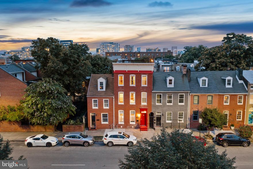 FELLS POINT -  Just STEPS away from the water and all of your favorite spots in the city, 618 S. Washington St is a 3 bed, 3.5 bath rowhome and is exactly the one you have been waiting for! As you enter through the front door you will be greeted into the spacious family room featuring hardwood floors, a cozy fireplace and gorgeous custom tray ceilings. As you continue on you will find a powder room conveniently on the left and the dining area/kitchen straight ahead. The gourmet kitchen features granite countertops, tons of cabinets, stainless steel appliances, an oversized center island big enough to seat as many as 4 barstools and more. Tons of light fills the main level as there are 9 total windows, giving you the feeling of an end-unit home yet enjoying the comfort of being an interior unit. Off of the kitchen leads you to your own private oasis; a fully enclosed private stone terrace equipped with TONS of gorgeous landscaping (peonies, lilac bush, oak leaf hydrangeas, rose bushes and a fig tree with delicious figs just to name a few) along with your own custom fountain. This terrace is a TRUE serenity, the perfect place to entertain and also unwind. Upstairs leads you to two great sized bedrooms with two en-suite bathrooms. The front bedroom has a huge walk-in closet, a fireplace, tray ceilings and beautiful built-in shelving. Laundry is conveniently located in the hallway of this level. Upstairs one more flight brings you to another bedroom with its own full en-suite bathroom, along with access to the amazing rooftop deck featuring breathtaking city views! Hardwood floors are found throughout the entire home including some original. Recent updates include fresh paint, new windows and more! This is TRULY the perfect city home. Location cannot be beat!  *Home qualifies for 2 parkings permits and also a guest pass to ensure easy parking along the side of the street that the home sits on. There are also options to rent assigned parking spots one block away (garage covered and/or uncovered spots currently available).  Schedule your private tour today!