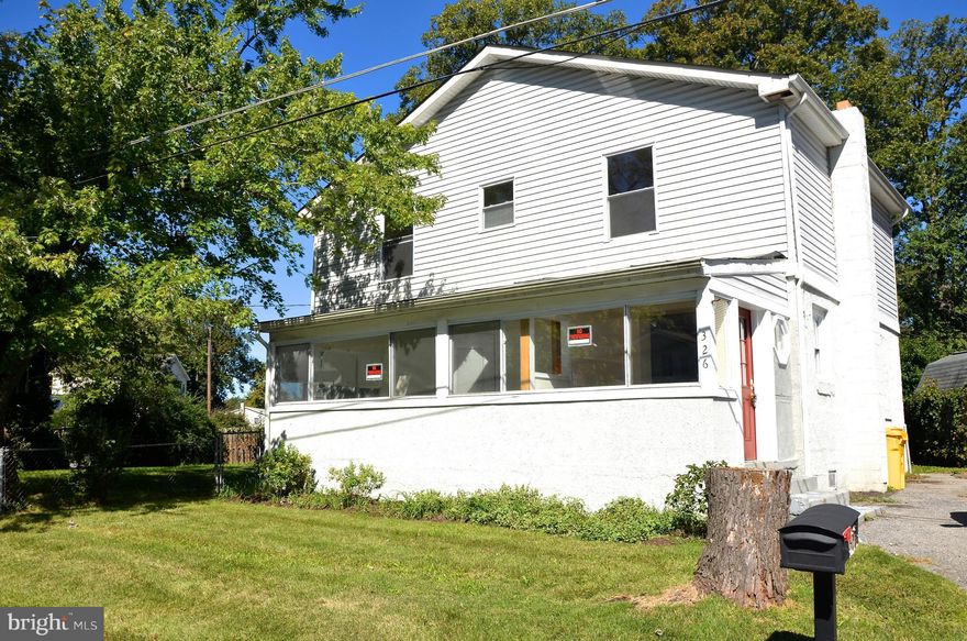 Water privileged Woodland Beach offers multiple beaches, marinas, ramps and playgrounds.    Open Floorpan with Hardwood Floors, kitchen with breakfast bar, Master bedroom with walk-in closet, second floor laundry, Newer paint and carpet, separate sunroom off of family room for lots of natural light, three full baths, large lot (tax record incorrect), walking distance to the water!