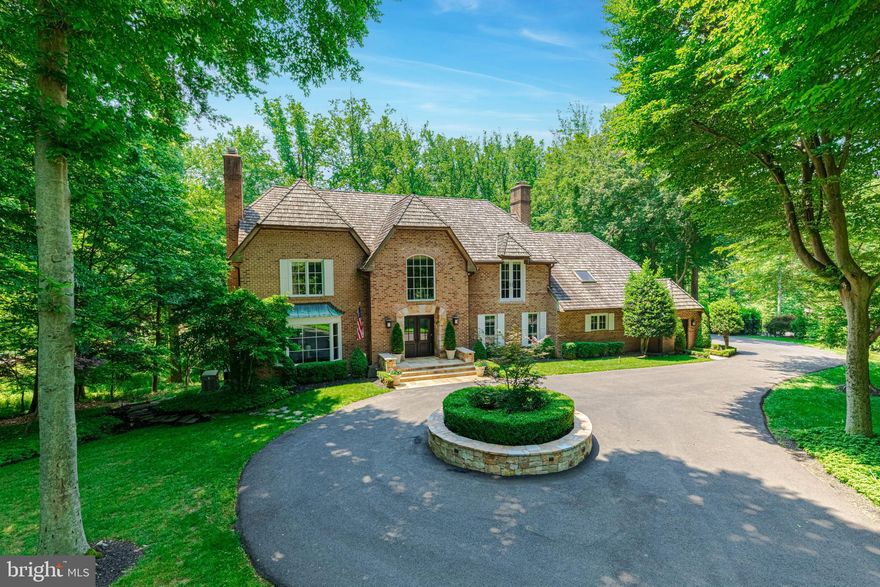Welcome home to 1 Oaklyn Court, a beautiful French-style colonial, located within the highly desirable Avenel neighborhood, without being a part of the incorporated HOA! This beautiful 5800+ square foot home sits on 2 serene acres affording both privacy and convenience, and has been updated with a thoughtful design for everyday living, as well as formal entertaining! On the main level you'll find a grand 2-story foyer opening to the formal living room and family room, which is complete with a showpiece stone fireplace and a wall of custom built-ins. Off the family room is another sun-filled room with a wall of oversized windows and an unobstructed view of the backyard/pool. The chef’s kitchen is complete with a Wolf cooktop, Bosch double ovens, and a SubZero fridge. Right off the kitchen is the elegant dining room, with space for 10+ seated guests. On the upper level you'll find the primary suite with vaulted ceilings and exposed wood beams, a sitting room/office, an updated primary bath, a large walk-in closet, additional climate-controlled storage, and a bonus exercise/rec room. Completing the upper level are three additional bedrooms with beautiful hardwood floors, and two additional full baths each complete with dual vanities. In the walk-out lower level, you'll find a 5th bedroom, newly redone full bath, a large rec room with a 3rd fireplace, a kitchenette, laundry room, and large storage/utility room. This is the perfect separate living space for an au/pair or guests! The exterior of this home features extensive hardscaping, landscape lighting, a WiFi-enabled irrigation system, custom stone-work around the front door and circular driveway, and a newly stained deck. This resort style oasis is complete with a southwest facing HEATED POOL, surrounded by private woods and beautiful mature trees! Bonus features of this home include a whole-house generator, newer Porcelanosa wood floors throughout the main level, newer HVAC system and hot water heater, Marvin windows installed throughout in 2016, new lower- level exterior door, custom Shade Store blinds, and so much more (please check documents section for a complete list)! Located minutes from shops and restaurants at Potomac Village and within steps of beautiful paths next to the lush Avenel Farm golf course for your morning and evening strolls!