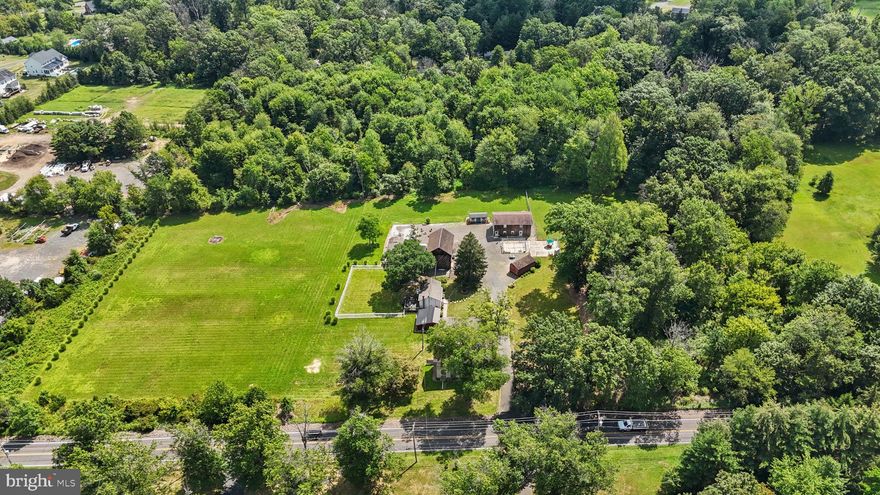 Rarely does a property of this scale and versatility come to market. Welcome to 2535 2nd Street Pike, Penns Park, Wrightstown Township, Bucks County.  This remarkable property totaling just under 7.98 acres with 515 Feet of 2nd Street Pike footage.  Included in this sale is the adjacent property 53-015-113 with 1.88 Acres with and additional 174 feet of  Street Pike footage.  Conveniently located near Richboro, New Hope, Newtown Boro, and all major commuting routes and shopping, the property blends seclusion with accessibility. Whether you dream of building a custom estate, running a home-based business, pursuing hobbies, or creating a multi-functional retreat, this property delivers. Key Features include Land: Totaling 9.87 acres across two parcels with multiple existing structures. Pole Barn: A double-insulated 48’ x 24’ (2,300 sq ft) structure with 200-amp service, propane backup heat pump, powder room, laundry, kitchenette, cabinetry, and an impressive second-story living area featuring an open floor plan, full kitchen, full bath, and large bedroom with elevated views.  Cottage: 600 Square feet with Detached oversized one-car garage, 1 bedroom, full bath, laundry, living room, and full kitchen with sliders opening to a wood deck overlooking a fenced yard, roof replaced 2022.   A 36’ x 24’ two-story barn with 4 stalls and electric, plus a 24’ x 14’ workshop with power. Additional Outbuildings: three sheds,  the red shed has  heat, air conditioning, electric and paneling.  Two outdoor fenced pet runs with adjoining fenced yard.  Original Farmhouse built in 1850's 30’ x 20 currently gutted still in place—offering potential for future renovation or restoration.  Zoned CR1, this property allows for a wide range of uses including residential construction, home occupation, landscaping, horticulture, or a small-scale business. The flexible zoning and multiple structures make it ideal for hobbyists, entrepreneurs, pet lovers, or anyone with a vision to transform this estate into something extraordinary. Every inch of this property offers serene, scenic views—an inspiring canvas for the buyer who wants to make their dreams a reality.