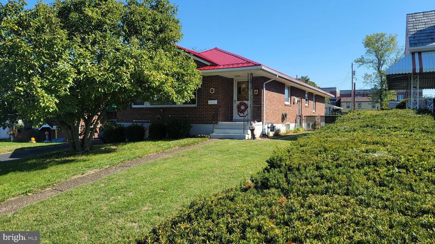 The ideal, one owner brick rancher is now available in a great neighborhood close to all the necessary services. Three bedrooms and 1 3/4 baths, the charming home is a unique open floor plan, plenty of windows to let in the light,  and has so many possibilities--all appearing to be cosmetic in nature. It has a new tin roof and a large, level lot. Main bath is definitely retro in style and would be so much fun decorating with today's touches. Second bath is located in the M. bedroom. Owner says that the home has hardwood floors throughout underneath original carpeting . Basement is large, unfinished, and open and could be made into a large family  room or more depending on your needs. So, get out your favorite home magazines, pull  up Pintrest on your computer and start dreaming of how very cool this lovely will be when you are finished!

Please note: there is a driveway on the left hand side of the house that is deeded to the house next door--it does not convey, however, with minimal work, a driveway to the carport can be created--there are a couple of options open (survey is available). Also, note the unique shed in the carport that was lovingly built by the family--this is a one owner home.