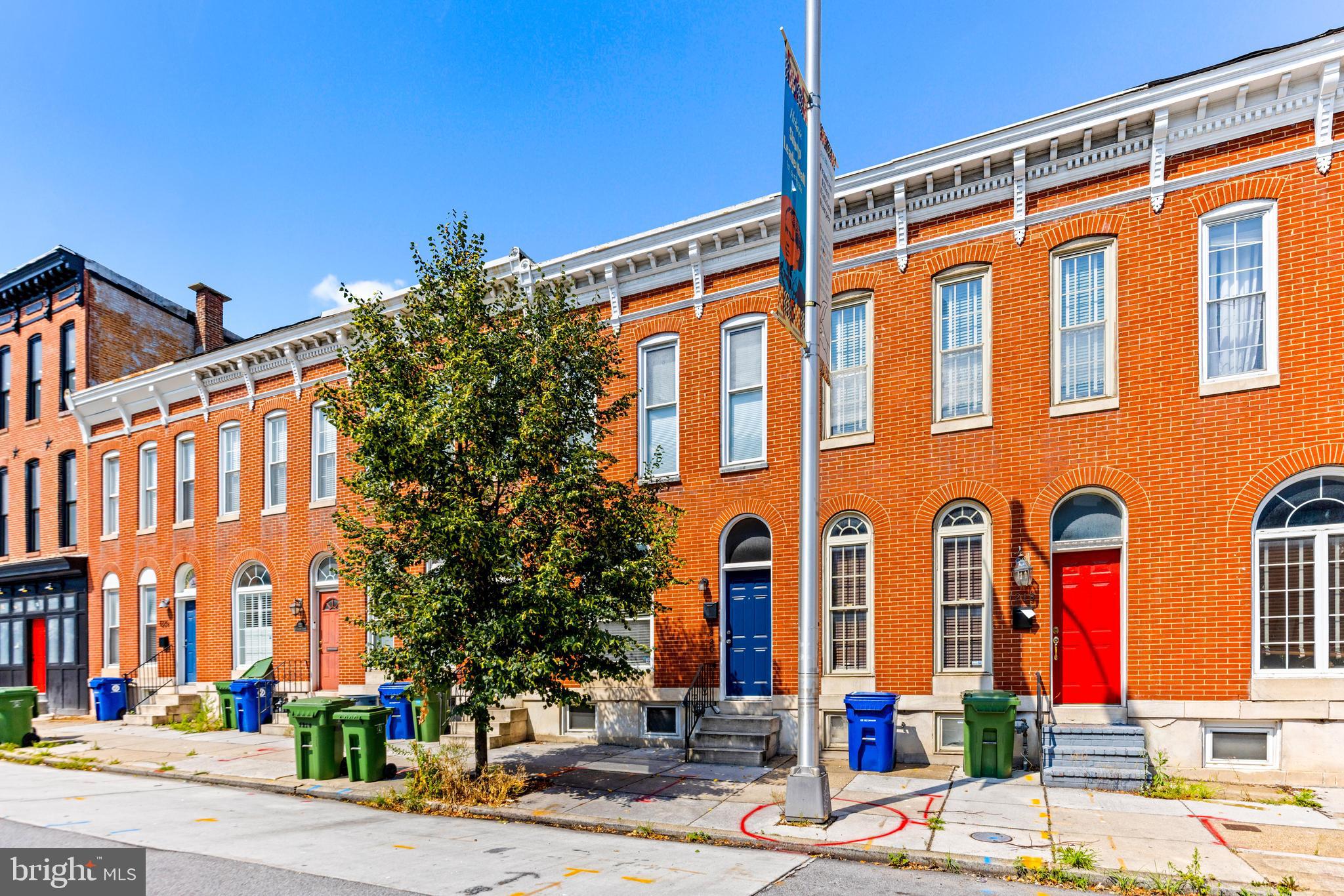 Welcome to 1220 S Hanover st, this 2BR/2.5BA With PARKING Baltimore Townhome is located in the heart of Baltimore's coveted Federal Hill. Open the door and step into your new home offering tons of natural light, tall ceilings , beautiful hardwood floors, and an exposed brick wall. The main floor offers an open floor plan featuring a spacious living room with a fireplace encased in the original brick wall, an open dining room, a half bath, main floor laundry, and kitchen. Make your way to the kitchen that features plenty of cabinets finished with stainless steel appliances, a stainless sink set into an island with a raised breakfast bar, and room for a breakfast table. On the second floor is a spacious secondary bedroom with a full bath, and a large primary suite. The primary boasts a large closet, and private en suite . The lower level provides an abundance of storage. This Federal Hill gem offers a sophisticated urban lifestyle with exceptional indoor and outdoor living spaces.