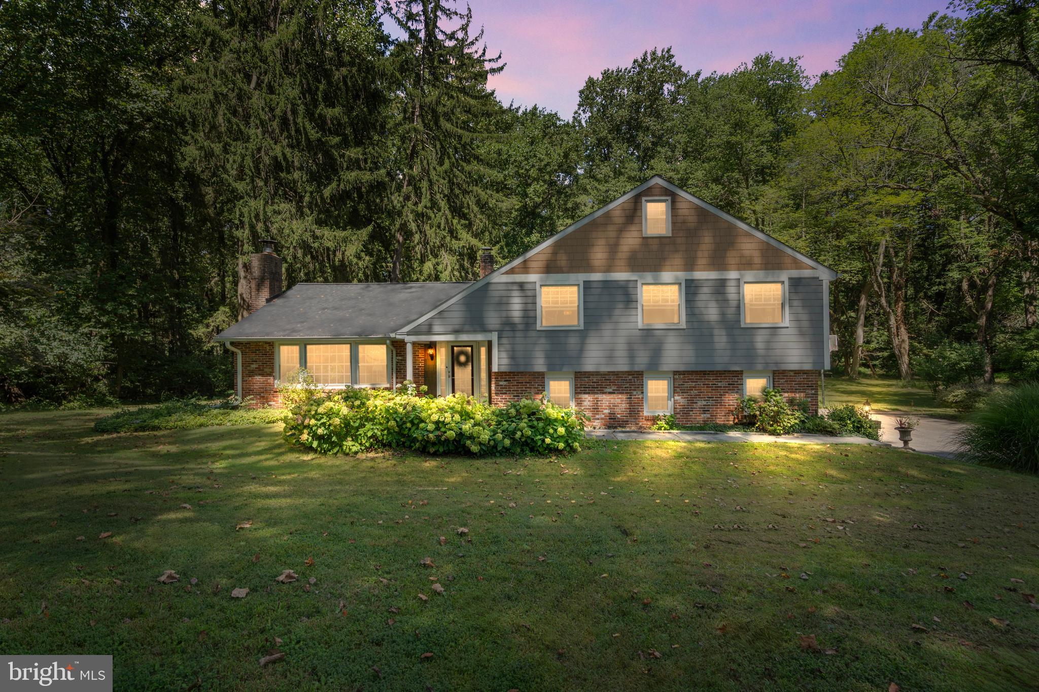 Welcome to 105 S Fairville Road in scenic Chadds Ford—a rare opportunity to own a spacious and beautifully maintained split-level home, updated with James Hardie Plank Siding, Wood Trim, and brick in the highly sought-after Unionville–Chadds Ford School District. Nestled on 2.1 acres in picturesque Pennsbury Township, this 4-bedroom, 2.5-bath residence offers both privacy and convenience, surrounded by mature trees and natural beauty.
Step inside and you’ll immediately feel the warmth of this home. The formal living room is filled with natural light from an oversized bay window and anchored by a charming fireplace—an inviting spot for relaxing or entertaining guests. The bright and functional eat-in kitchen features ample cabinetry and a comfortable dining area that opens directly onto a deck overlooking the wooded backyard. This seamless indoor–outdoor flow makes it easy to host summer gatherings, enjoy morning coffee with a view, or simply unwind in nature.
Upstairs, the primary suite is spacious with multiple closets and includes a private bathroom. Three additional generously sized bedrooms share a full hall bath, providing plenty of space for family or guests. A spacious walk-up attic adds incredible storage and the potential for future expansion.
The lower level extends the home’s living space with a cozy family room featuring built-in bookcases—ideal for displaying books, photos, or a personal library. Step outside from here onto a paver patio, the perfect setting for an evening firepit or quiet nights under the stars. Throughout the home, gleaming hardwood floors add timeless character and charm.
Beyond the property itself, the location is truly exceptional. Just minutes away are world-renowned cultural and recreational destinations such as Longwood Gardens and the Brandywine River Museum of Art, along with the convenience of tax-free shopping in Delaware. Easy access to Route 52 ensures a smooth commute while keeping you close to the area’s best dining, shopping, and entertainment.
Offering the perfect blend of space, charm, and location, 105 S Fairville Road is ready to welcome its next owner. Don’t miss the chance to experience all that this special home has to offer.
