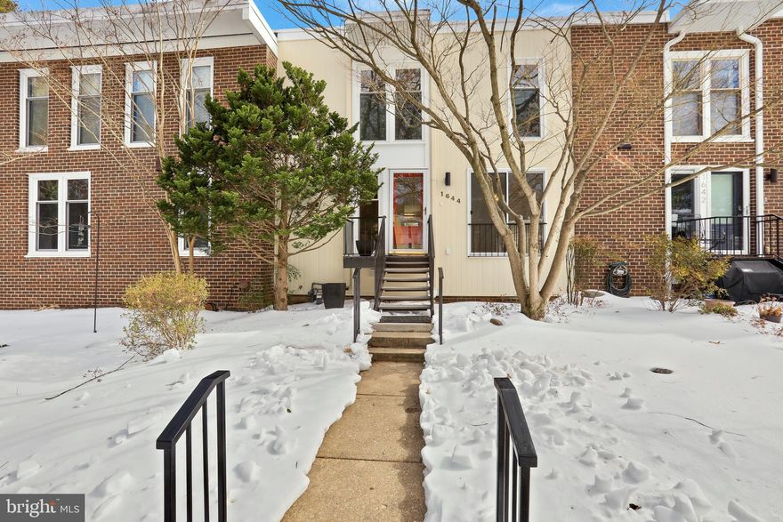 A Mid-Century Vision, Move-In Ready. Set in Reston's historic Coleson Cluster, this three-level townhome is part of a community designed by renowned architect Chloethiel Woodard Smith. Her signature is evident throughout: light-filled rooms, expansive windows, and a thoughtful connection to shared green space. Close to Lake Anne, a nationally recognized historic district celebrated for its bold mid-century waterfront plaza, this home embodies Reston's founding vision of walkable, community-centered living. 

1644 Wainwright Drive has been refreshed and updated for modern living while honoring its architectural character. Hardwood floors refinished in 2026 flow across the main and upper levels and stairs, complemented by fresh paint and new light fixtures that enhance the mid-century aesthetic. The kitchen features granite countertops, ample cabinetry, and stainless steel appliances replaced in 2025. The upper level offers three bedrooms and two full bathrooms, including a renovated primary bath (2016) and walk-in primary closet. The main level boasts a sun-drenched living room with wood-burning fireplace, custom lights, sliding shutters, and deck access, plus the kitchen, dining room, and a powder room. The lower level, with new LVP flooring (2026) and its own half bath, walks out to a private patio and includes a generous rec room ideal for a guest suite, home office, family room, or combination. There is no shortage of storage in the home, including the 170 sqft storage room that could easily convert to a home gym. The floors were just painted (2026) in the storage room and laundry/utility room on lower level. A brand-new AC system (2026) and water heater (2019) provide peace of mind.  Additional highlights include the porcelain tile kitchen floor (2022), recently painted exterior (2024), and deck and patio were just power washed (2026). 

As a Reston resident, you'll enjoy unparalleled community amenities. The North Shore pool and tennis courts are only 1/2 mile away, but you have access to all 15 pools, over 50 tennis and pickleball courts, scenic parks, over 55 miles of trails, and stunning lakes perfect for kayaking, paddle boarding, and fishing. Beyond Lake Anne's charming plaza, you will enjoy close proximity to the restaurants and shopping of Reston Town Center and Reston Station. Easy access to both the Dulles Toll Road and Route 7, the Reston Town Center Metro station is just 1.5 miles away, and Dulles International Airport is under 8 miles.  Steps to Lake Anne Elementary School and about 4 miles to Langston Hughes Middle School and South Lakes High School. This is a rare opportunity to own a piece of Reston's design legacy in a move-in ready package. Welcome home! *Any photos with furniture are virtually staged*