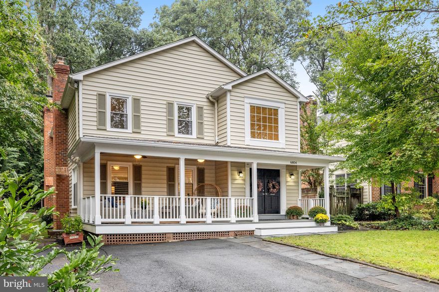 *****Offers due by 3pm, Monday October 2nd*****
Updated throughout this 4 bedroom, 3.5 bath home is much, much larger than it appears from the street with over 4100 square feet of finished living space and a private level backyard.   A large welcoming front porch with ceiling fans greets all who visit and provides an additional space to relax, read, or entertain.  Enter into the home through the double front doors and step into the two-story foyer with   refinished hardwood flooring that flows throughout the entire main level and up the staircase to the bedroom level.  The living room has a corner gas fireplace, hardwood flooring, recessed lighting, crown molding and plantation shutters for added charm.  The dining room flows seamlessly from the living room and has holds the second gas fireplace, wainscoting, crown moldings, plantation shutters and chandelier.  The main level Library/Office has French Doors for privacy as well as custom built in bookcases and dual desk spaces making it a perfect work from home or study space.  The renovated kitchen with luxe inset white cabinetry, center island with bar stool space for four, newer GE Cafe Stainless Steel appliances including the double oven range with gas burners and center griddle area is surely the heart of the home as it opens directly into the spacious family room boasting 16’ high ceilings with floor to ceiling windows and dual sliding glass doors taking full advantage of the views of the wooded backyard. The wood burning fireplace in the family room not only adds character, but also warmth to cold winter nights. The backyard will beckon you to go out, relax, and dine and entertain on the composite deck, or garden and play in yard while enjoying the sights and sounds of nature.  
     Upstairs you will find the enormous primary bedroom suite with attached full bath, ample closet space and its own private balcony.  Two additional large bedrooms and another full bathroom round out the top level. A fourth bedroom with another full bathroom, laundry room, recreation room with another woodburning fireplace and exercise area, workshop/storage room, and utility room can be found on the lower level.   
      Additional Upgrades: New Gas Furnace and Heat Pump 2022.  Kitchen Appliances 2021. LG Front Load Washer and Dryer 2022. Wood burning fireplaces serviced/cleaned 2022. Fresh paint 2023. Front Porch Ceiling Fans 2022. Updated lighting and Recessed lighting 2022-2023.  New flooring & fixtures  in the Powder Rm 2022.  Custom Hunter Douglas window blinds. Plantation shutters. blinds for the family room. Egress window basement (2022). Storage Shed. 
     Located in the top-rated Churchill, Cooper, Langley school pyramid and in the highly sought after neighborhood of Kings Manor but not subjected to the HOA fees, you can enjoy the all the parks, walking trails, festivities and walk to downtown McLean for dinner or shopping. Minutes to Tysons, Metro, Routes 495,267, and 66 make this an amazing location and house to call your new home.